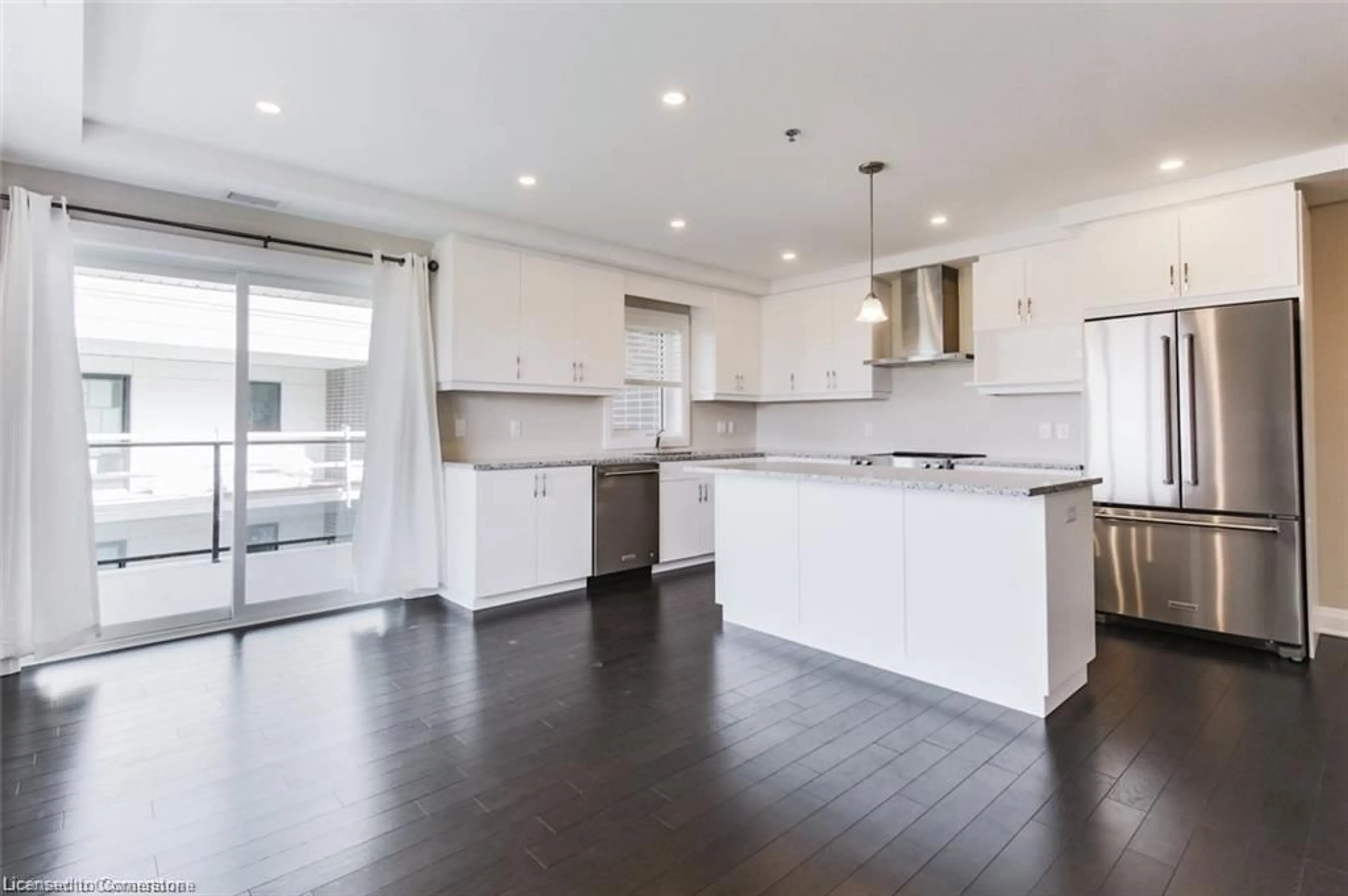 Open concept kitchen, wood/laminate floor for 245 Grey Silo Rd #406, Waterloo Ontario N2K 0B6
