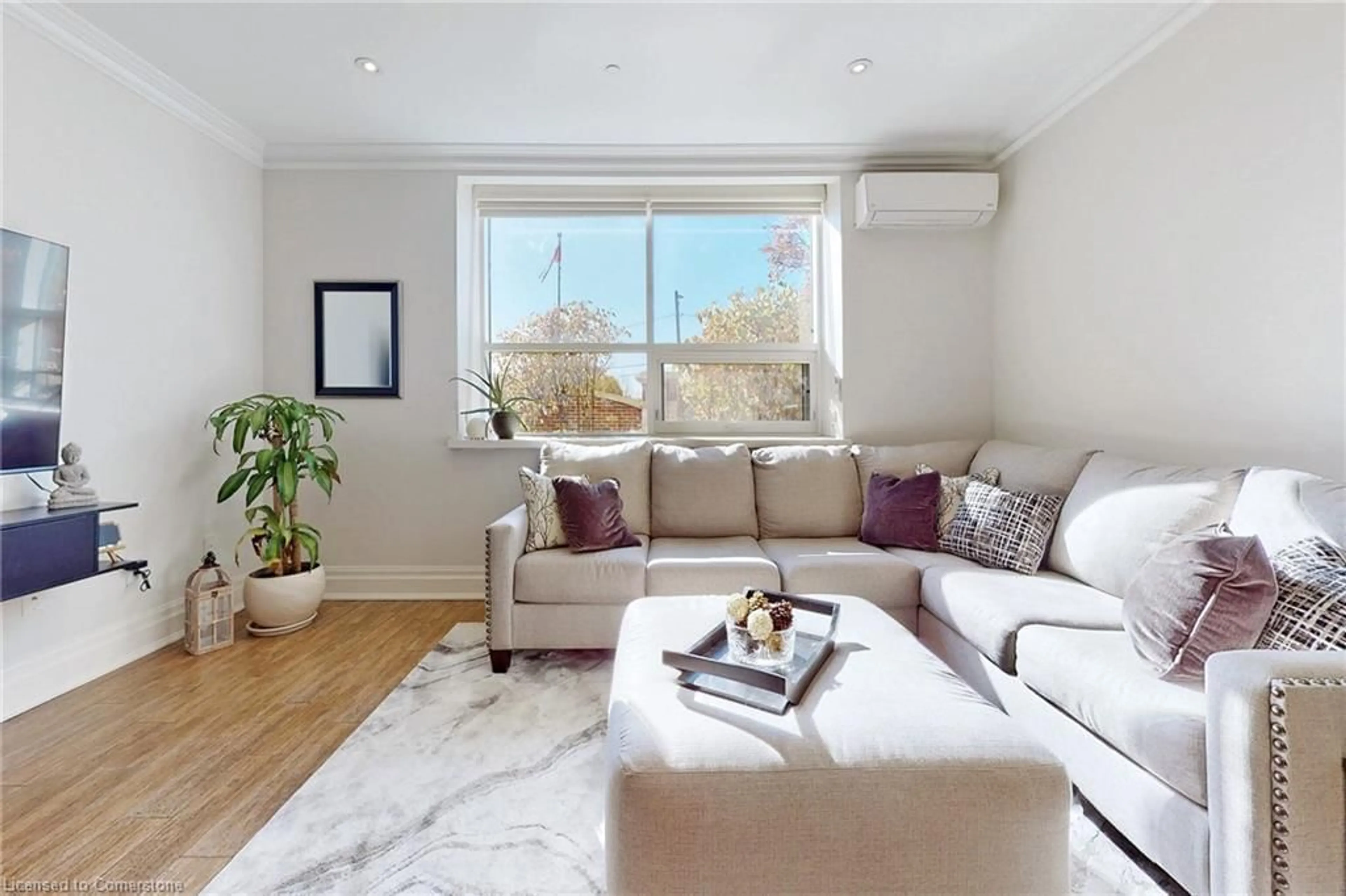 Living room with furniture, wood/laminate floor for 397 King St #108, Dundas Ontario L9H 1W9