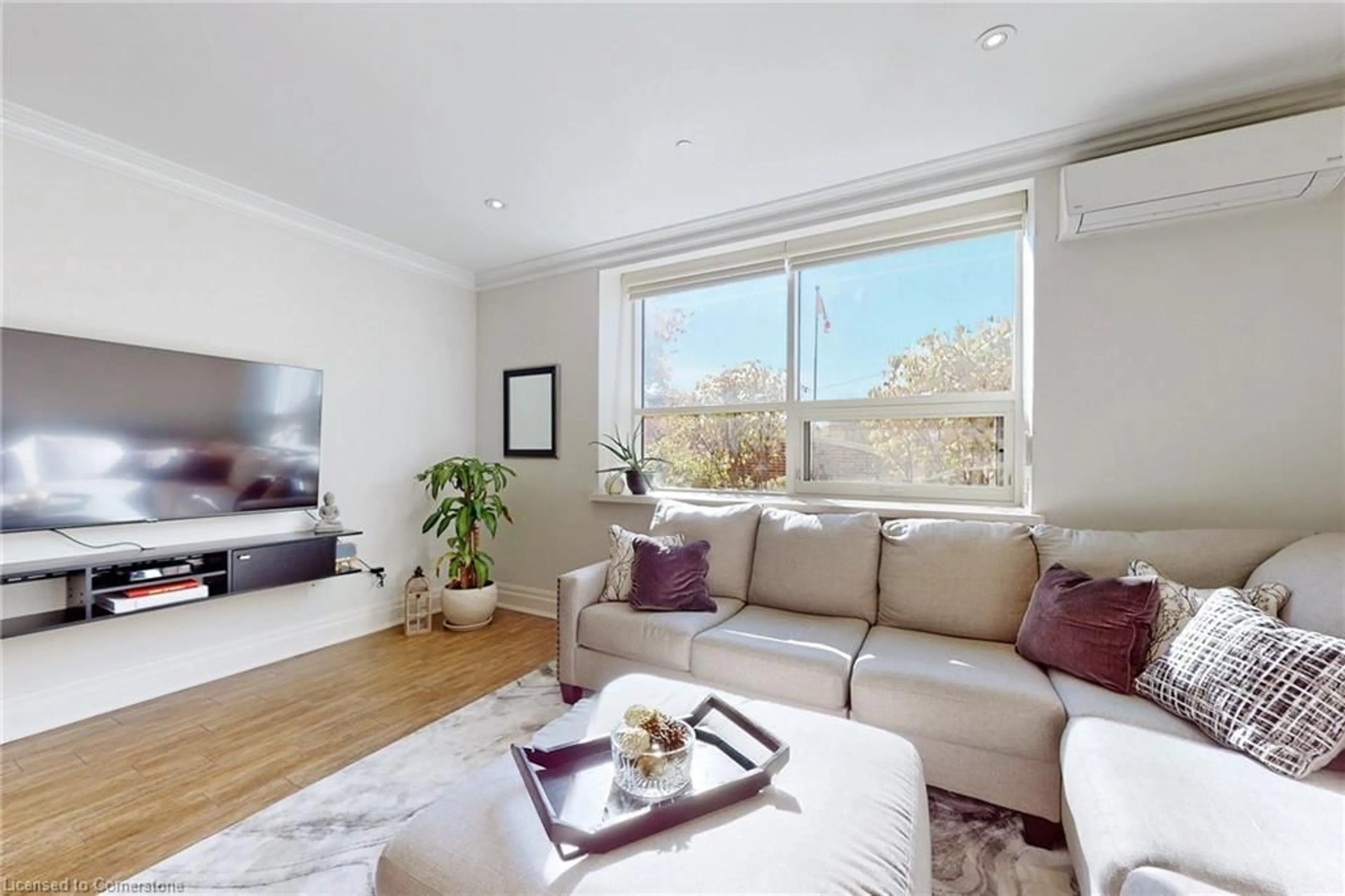 Living room with furniture, wood/laminate floor for 397 King St #108, Dundas Ontario L9H 1W9