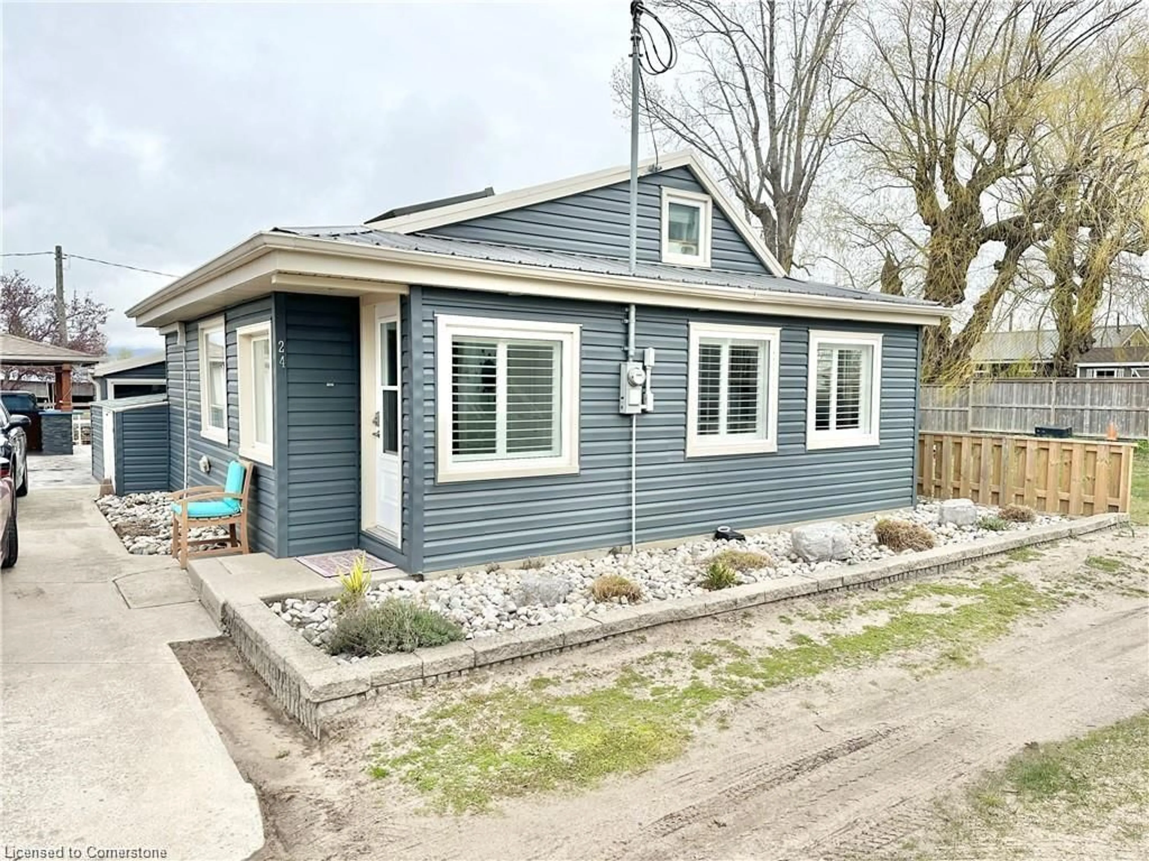 Home with vinyl exterior material, street for 24 Private Lane, Long Point Ontario N0E 1M0
