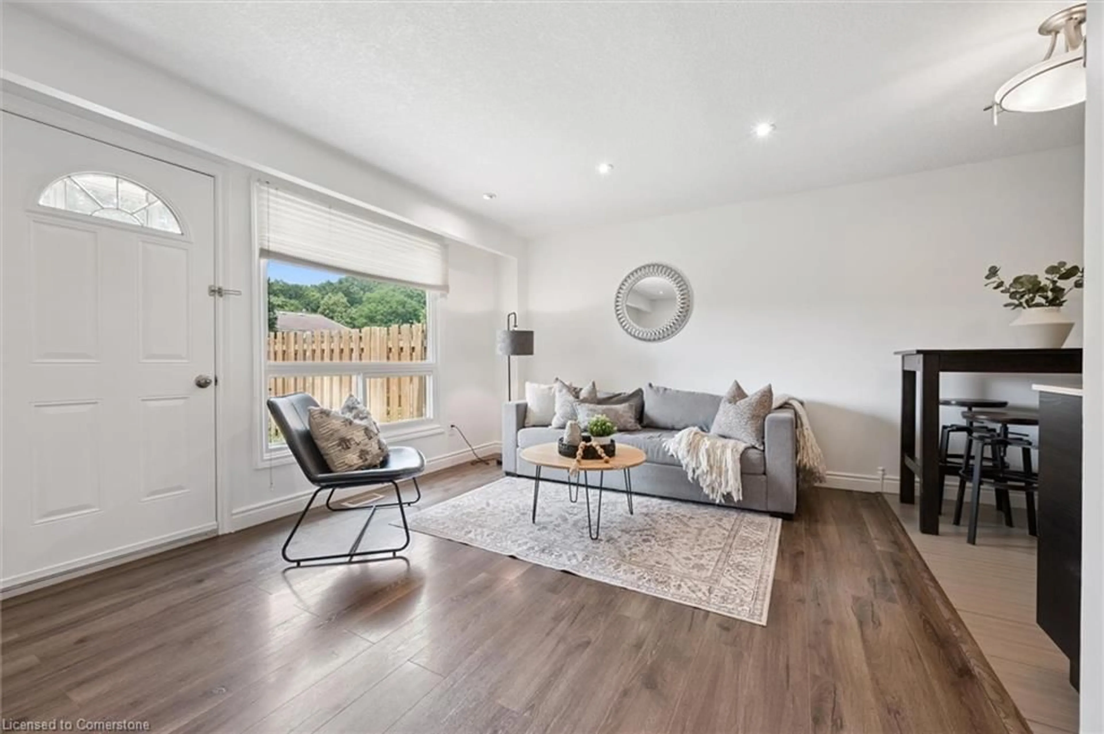 Living room with furniture, wood/laminate floor for 165 Green Valley Dr #41, Kitchener Ontario N2P 1K3