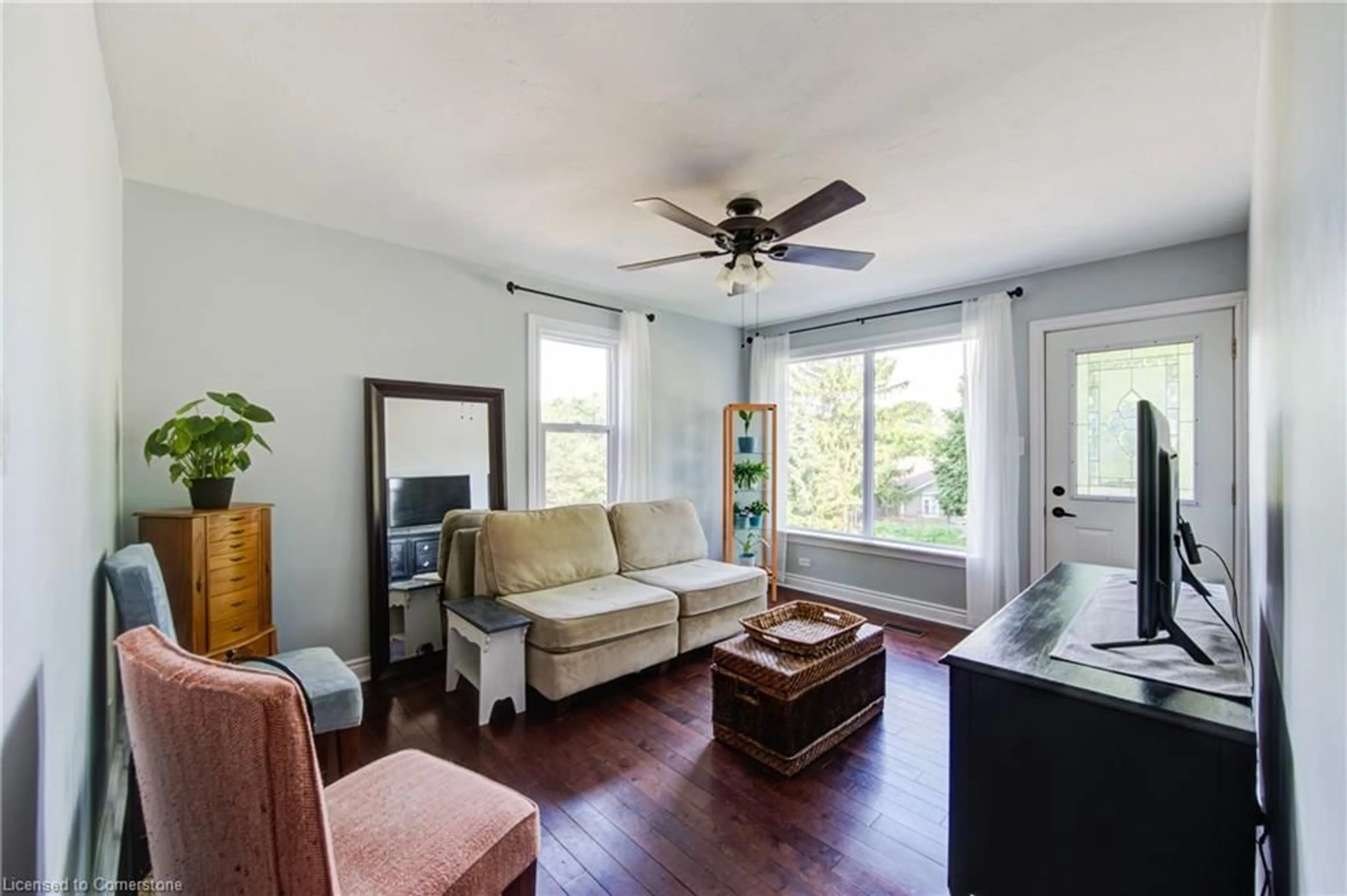 Living room with furniture, wood/laminate floor for 388 Mill St, Woodstock Ontario N4S 7V6