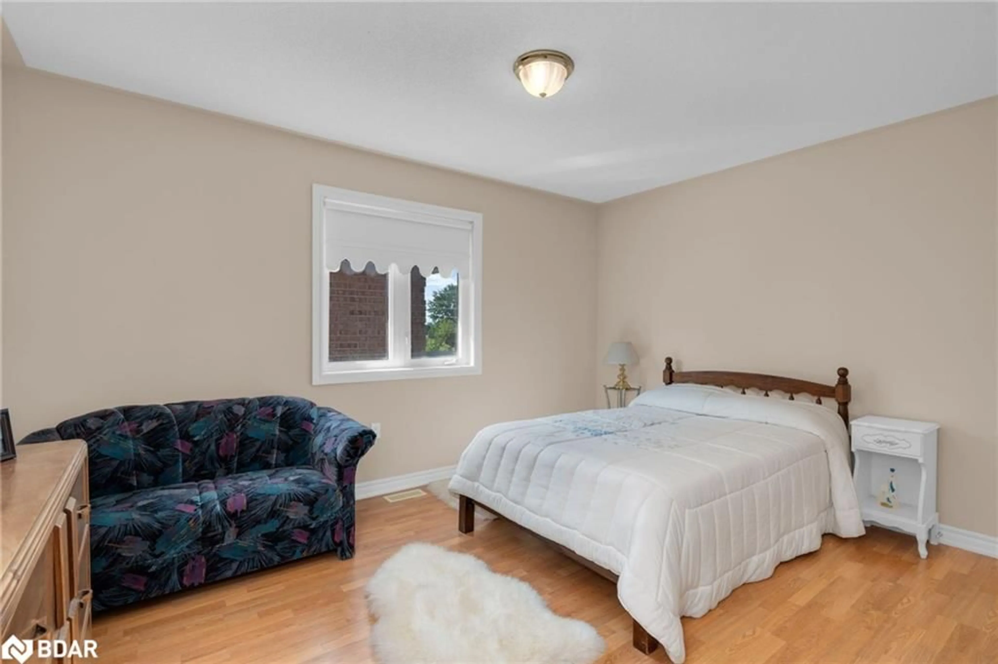 Bedroom with bed, wood/laminate floor for 503 Simcoe Rd, Bradford Ontario L3Z 3C4