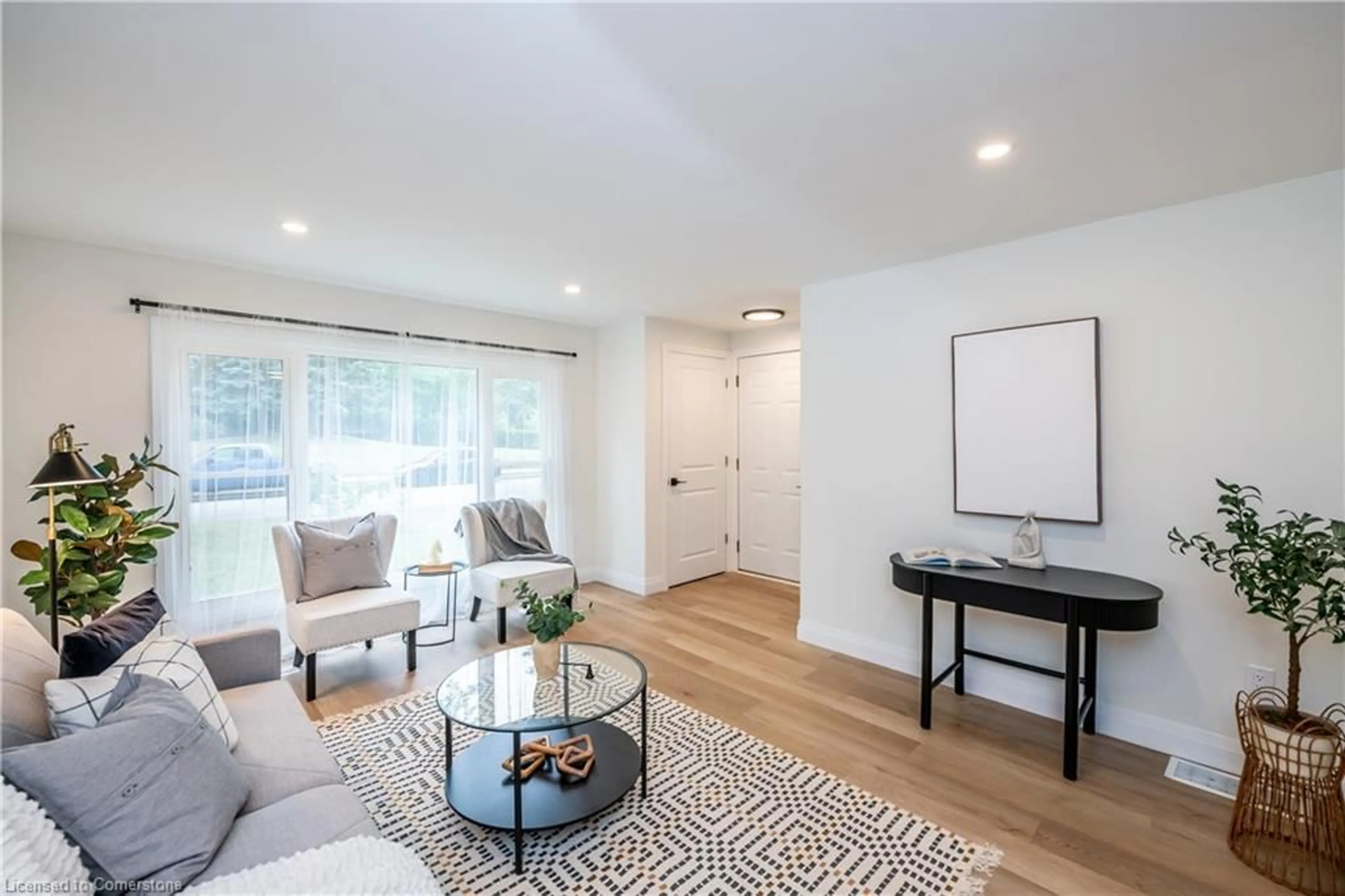 Living room with furniture, wood/laminate floor for 14 Louis Ave, St. Catharines Ontario L2M 2N6