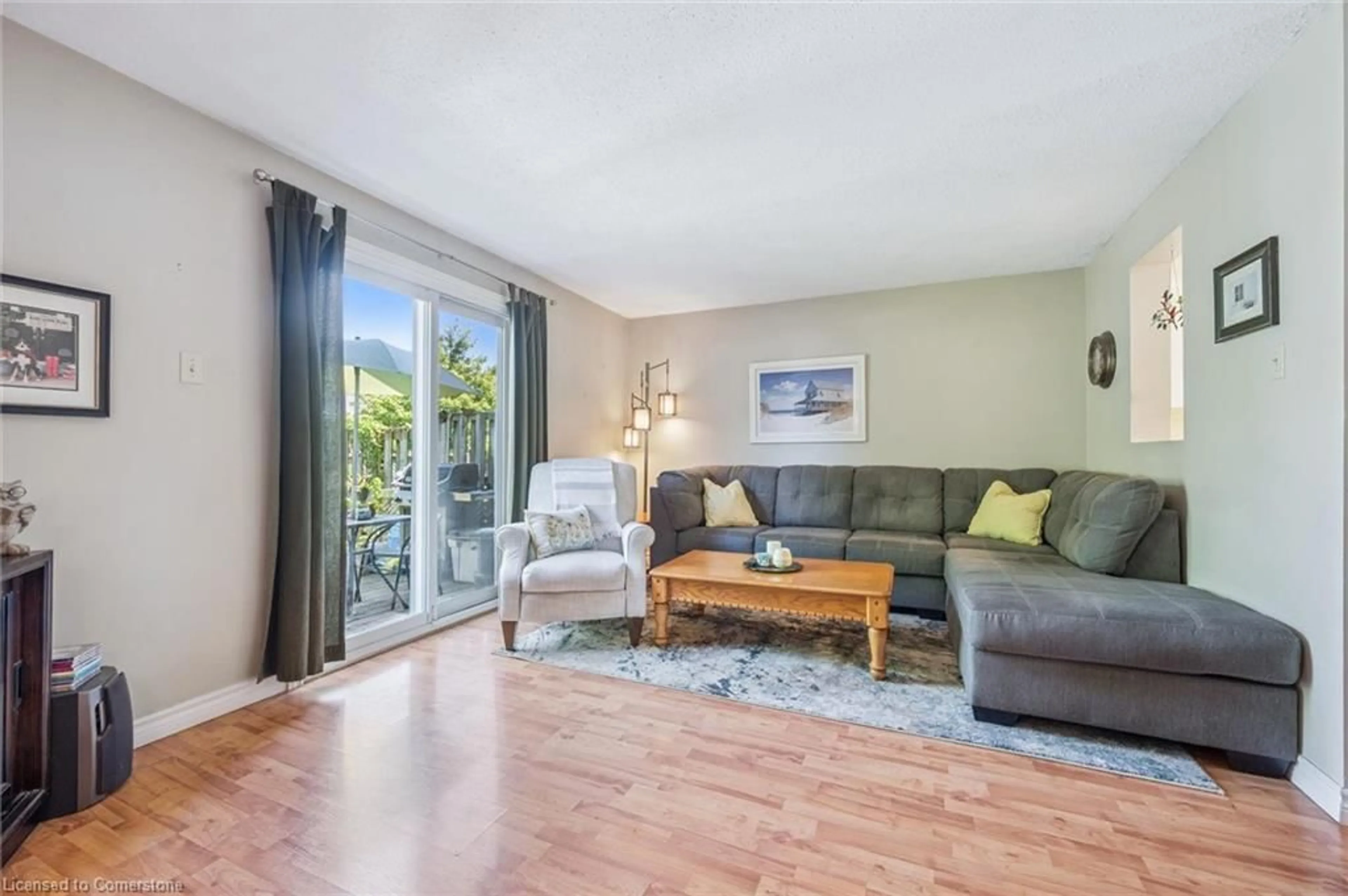 Living room with furniture, wood/laminate floor for 40 Silvercreek Pky #30, Guelph Ontario N1H 7X5