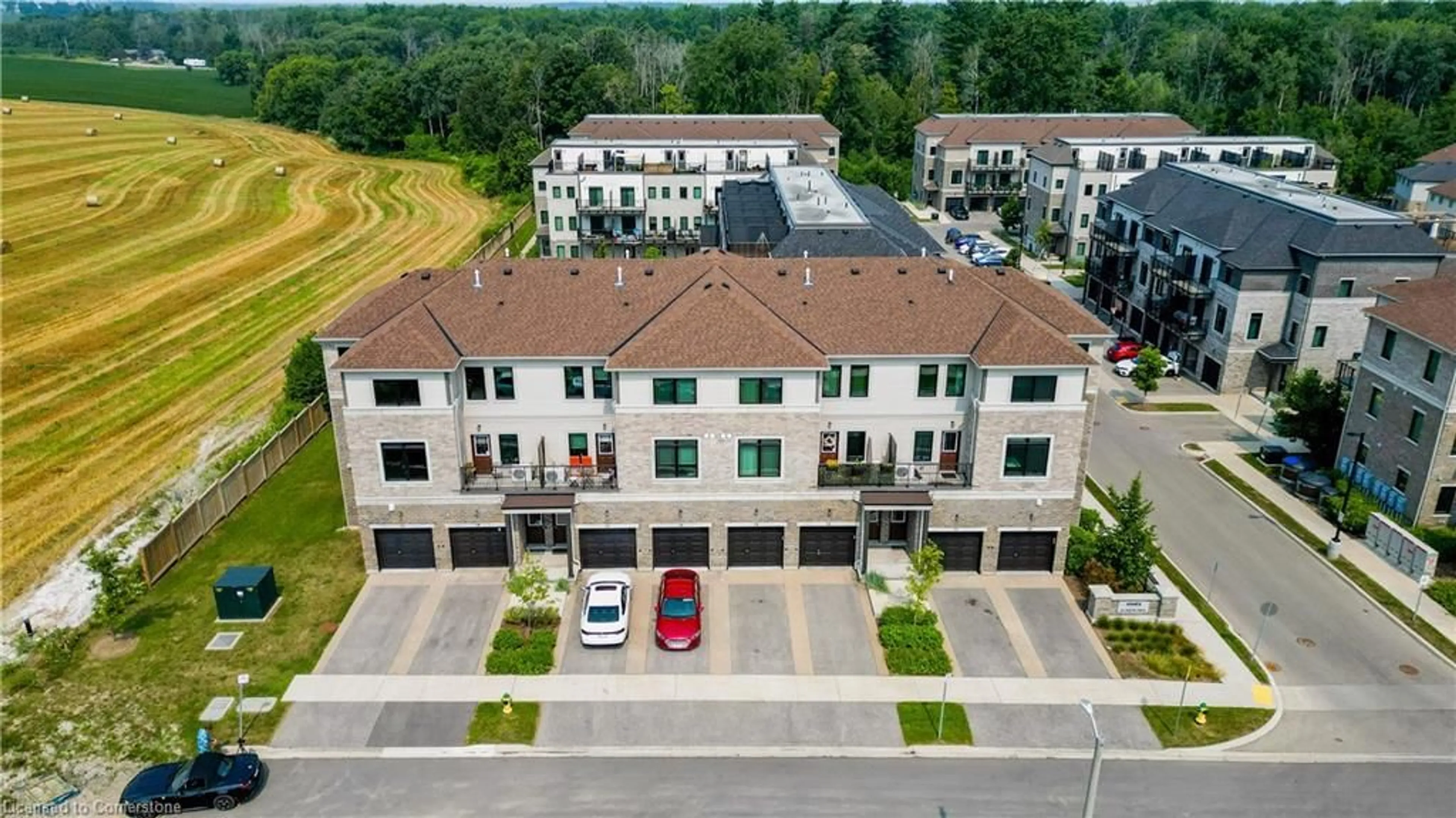 A pic from outside/outdoor area/front of a property/back of a property/a pic from drone, unknown for 107 Westra Dr #12, Guelph Ontario N1K 0A5