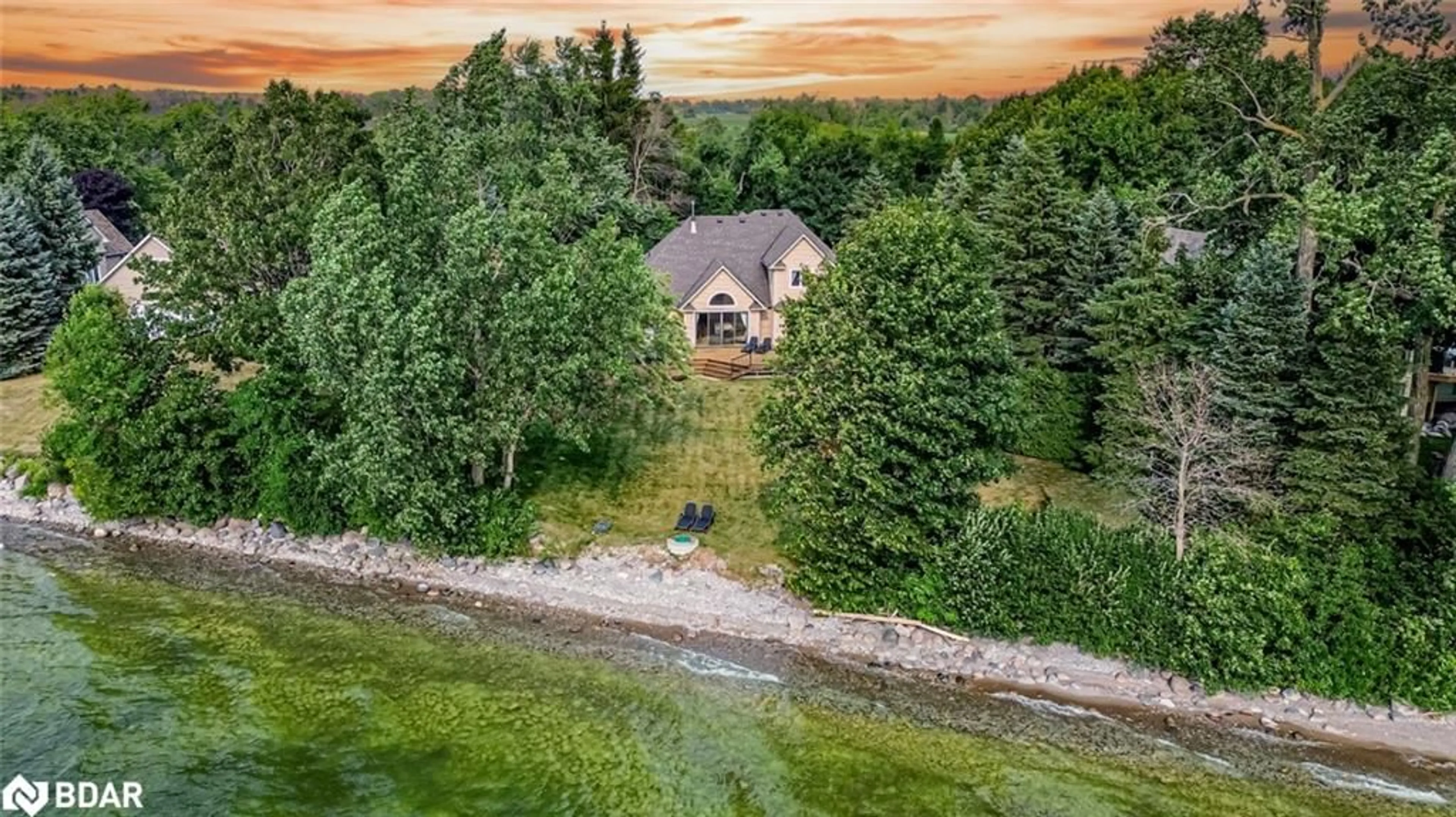 A pic from outside/outdoor area/front of a property/back of a property/a pic from drone, water/lake/river/ocean view for 1338 Spyglass Point Road, Brechin Ontario L0K 1B0