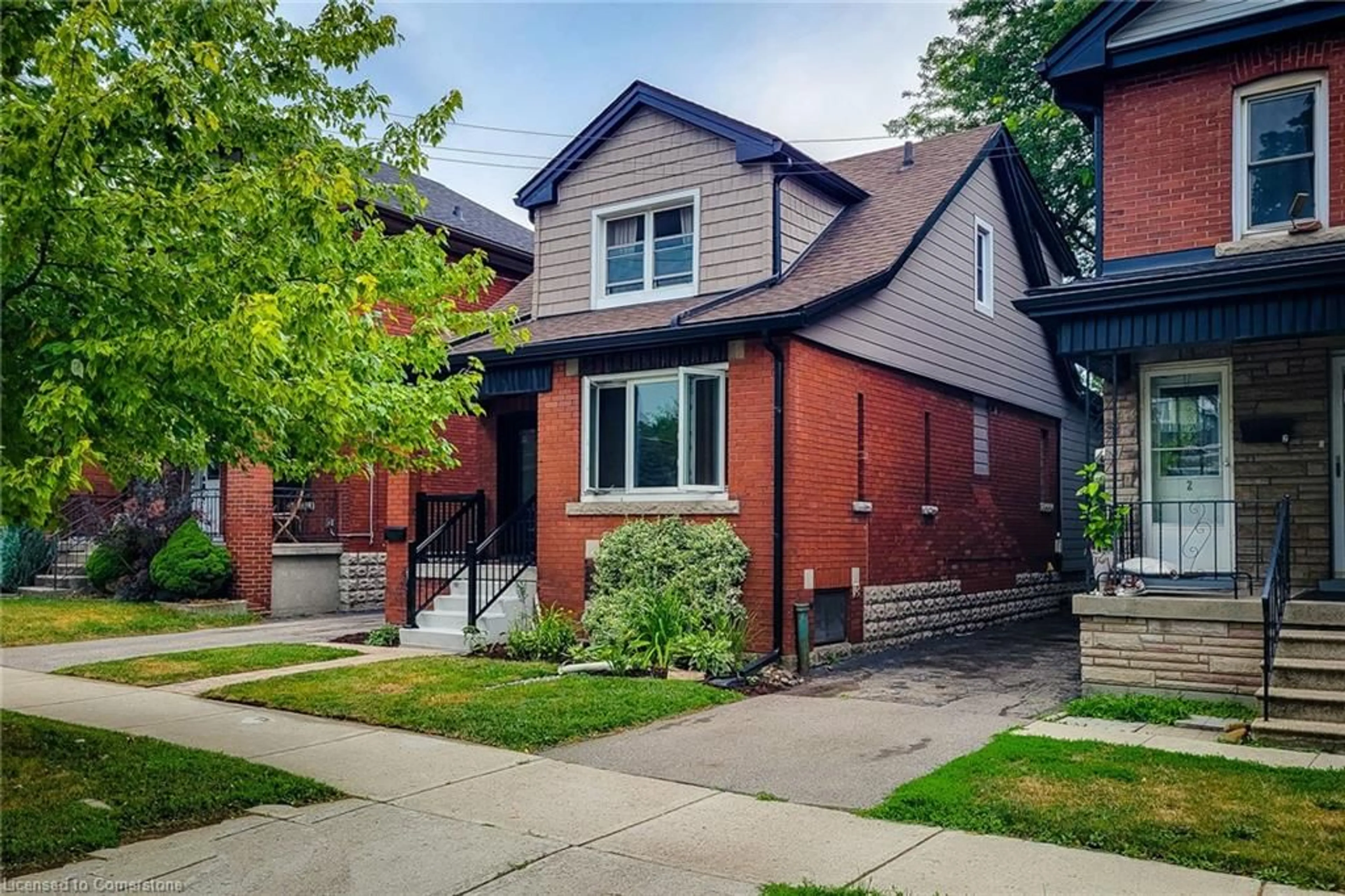 Home with brick exterior material, street for 156 Park Row, Hamilton Ontario L8K 2J8
