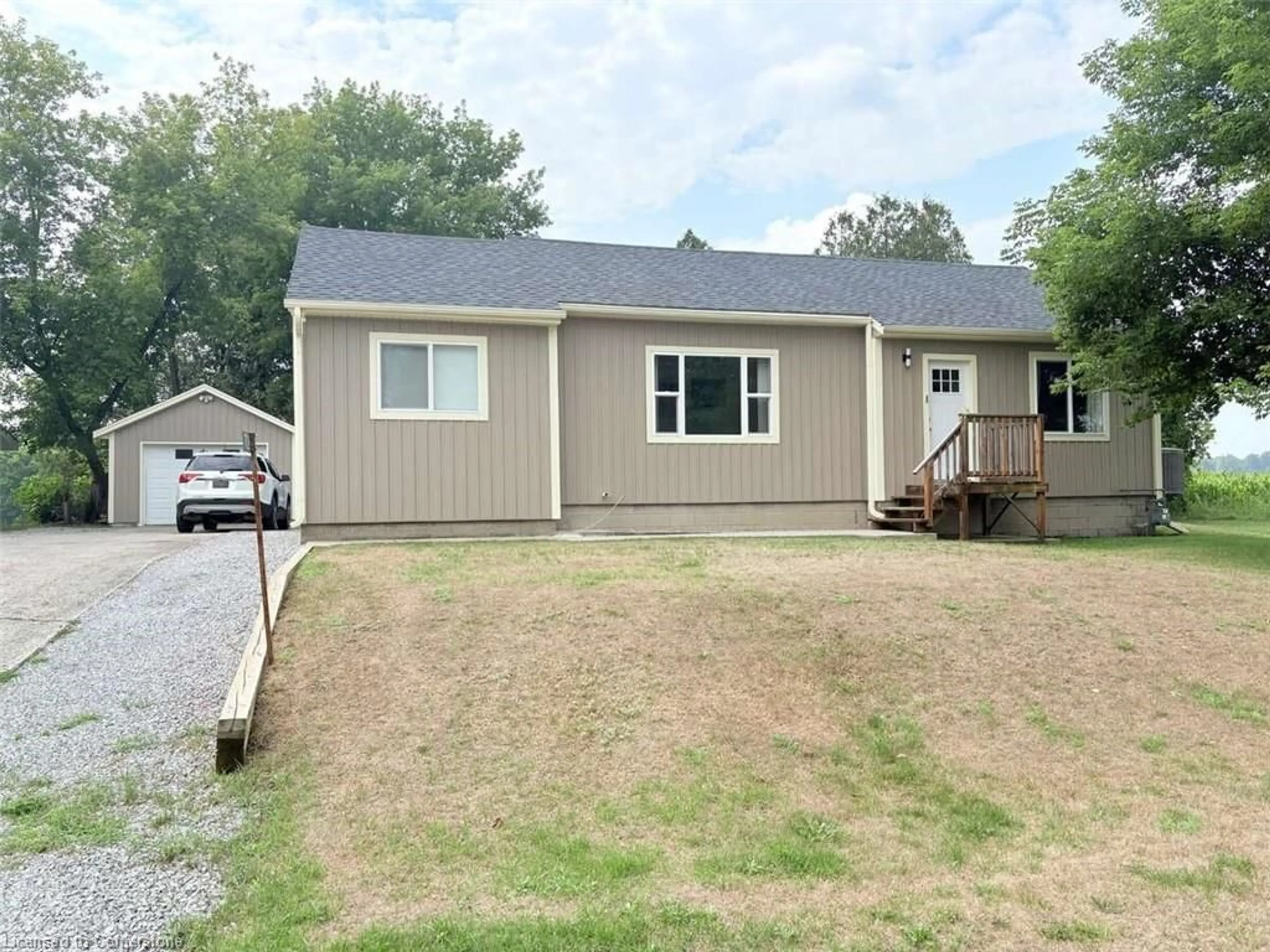Home with vinyl exterior material, street for 709 Norfolk County Road 28, Langton Ontario N0E 1G0