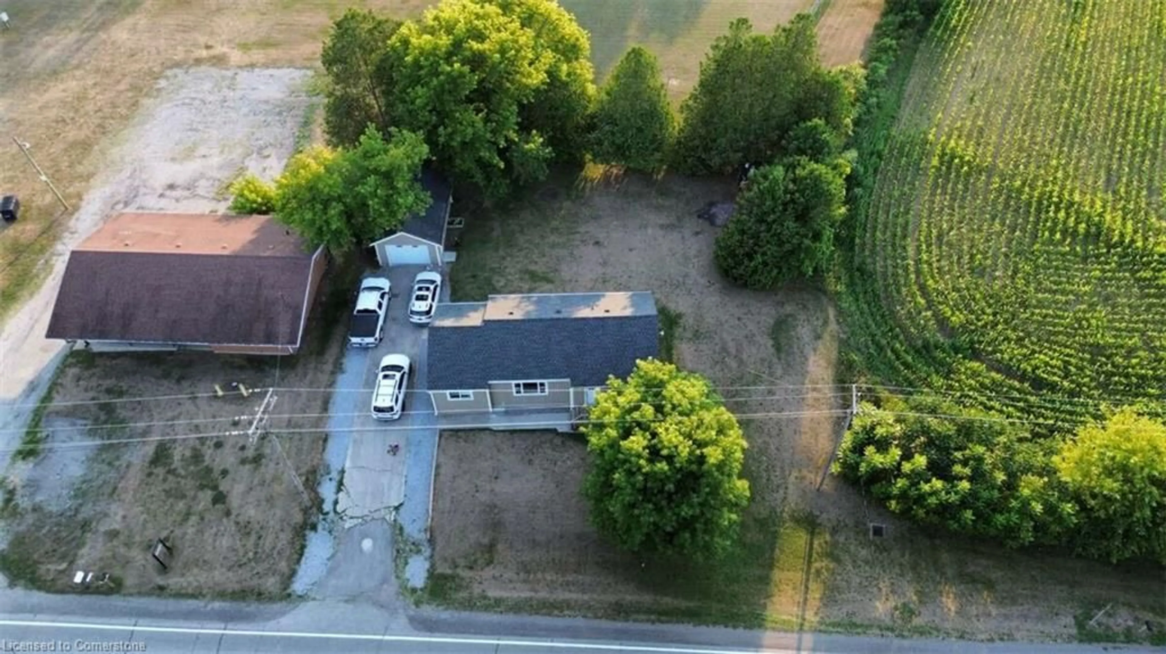 A pic from outside/outdoor area/front of a property/back of a property/a pic from drone, street for 709 Norfolk County Road 28, Langton Ontario N0E 1G0