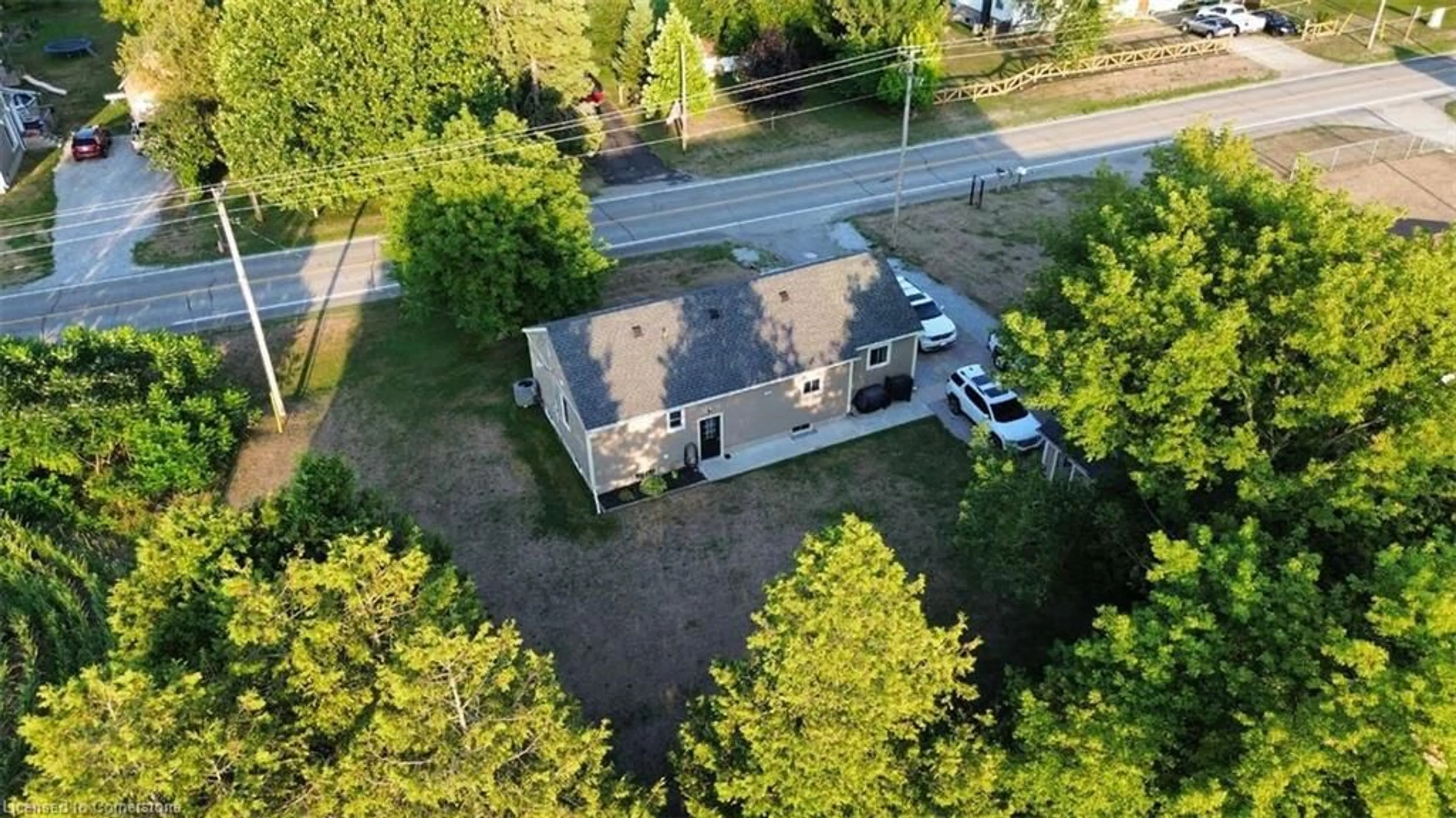 A pic from outside/outdoor area/front of a property/back of a property/a pic from drone, street for 709 Norfolk County Road 28, Langton Ontario N0E 1G0