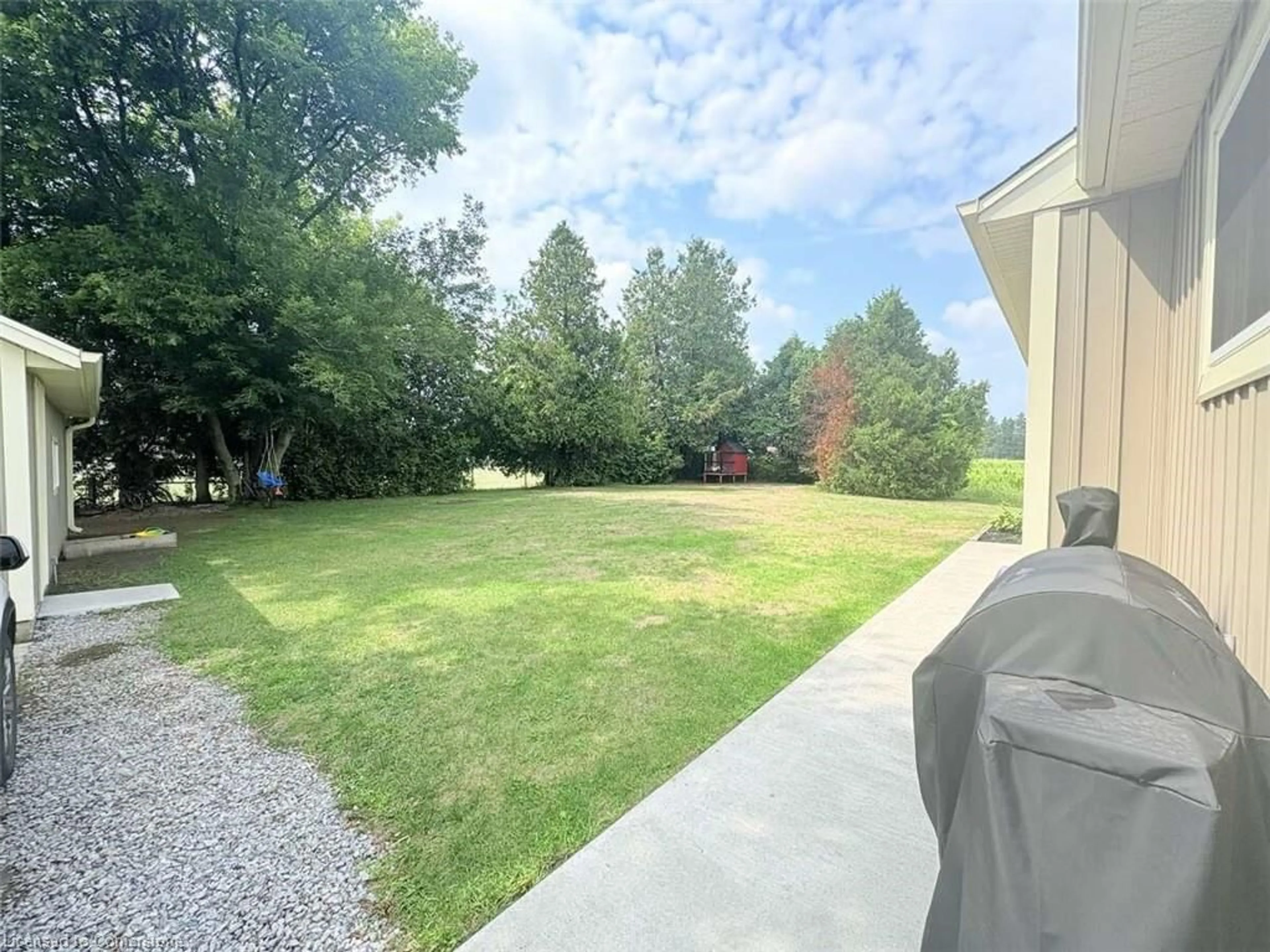 A pic from outside/outdoor area/front of a property/back of a property/a pic from drone, water/lake/river/ocean view for 709 Norfolk County Road 28, Langton Ontario N0E 1G0