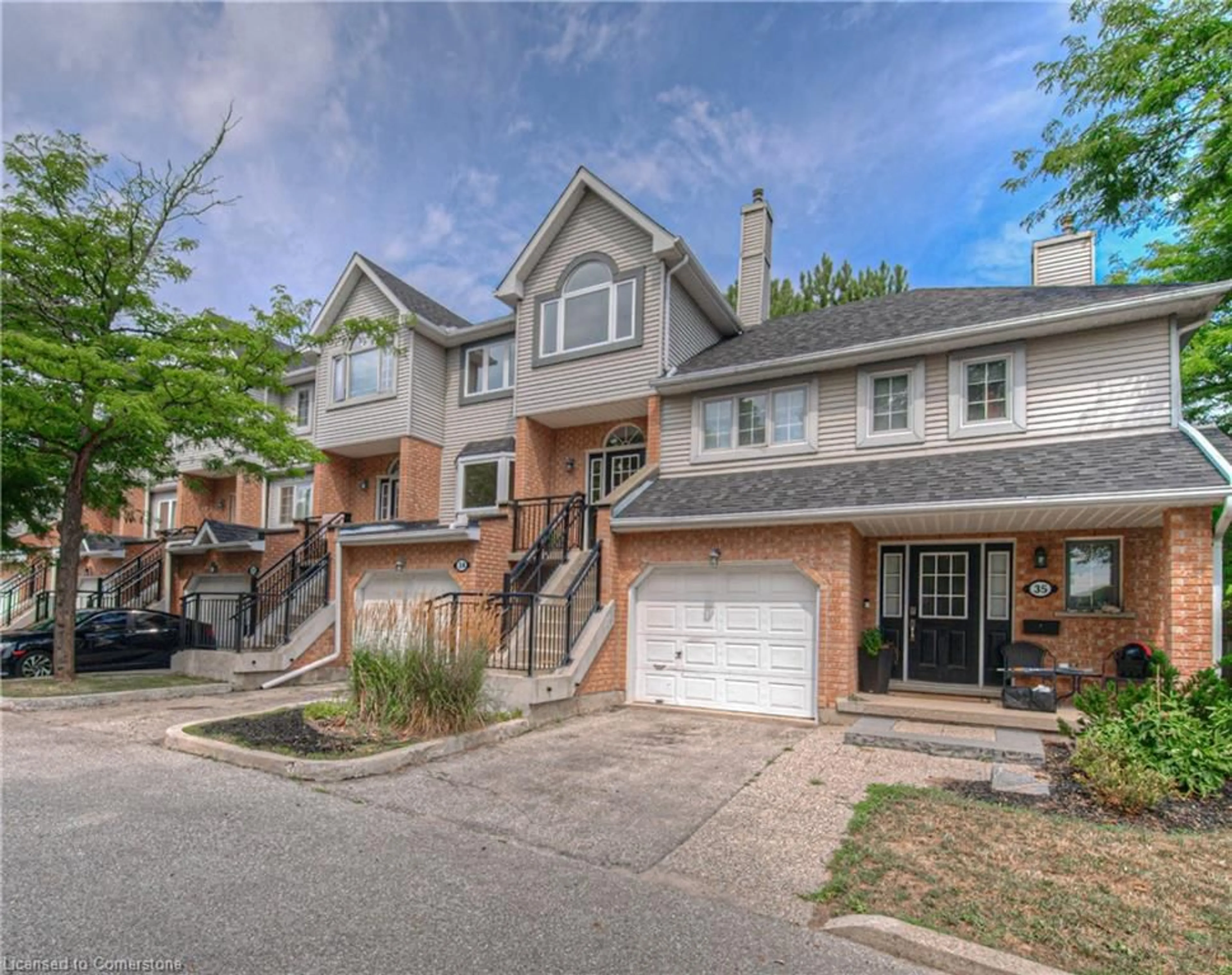 Home with brick exterior material, street for 310 Christopher Dr #34, Cambridge Ontario N1P 1B4
