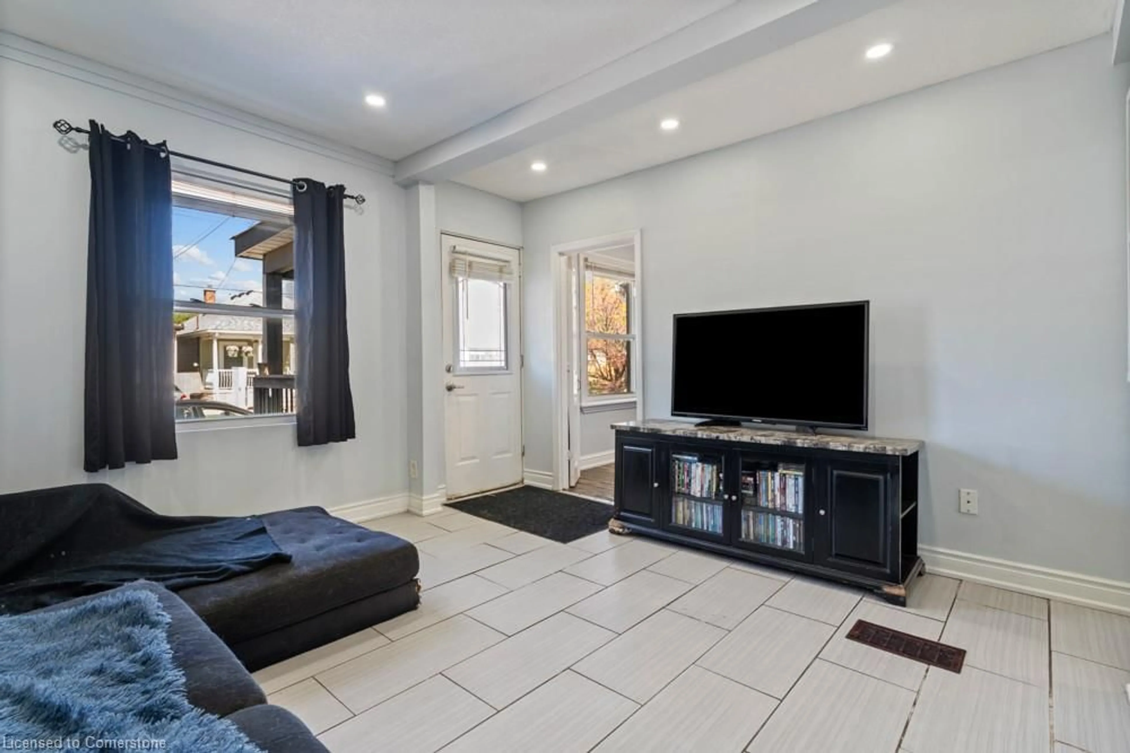 Living room with furniture, ceramic/tile floor for 30 Robins Ave, Hamilton Ontario L8H 4M9