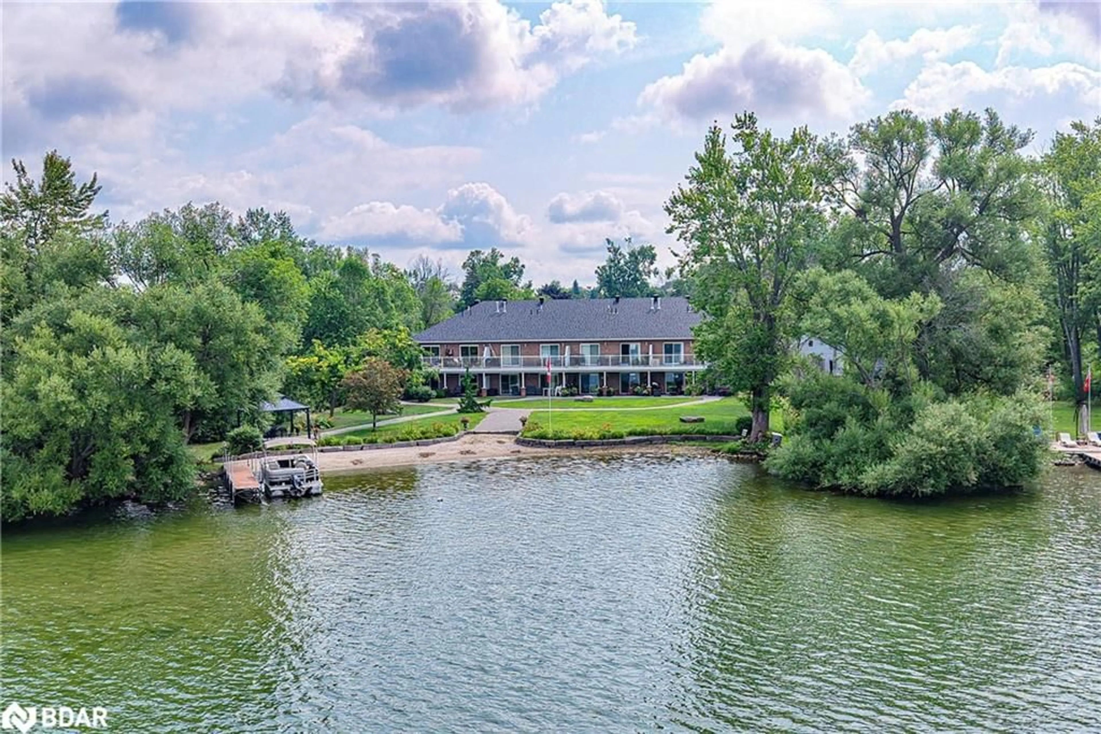 A pic from outside/outdoor area/front of a property/back of a property/a pic from drone, water/lake/river/ocean view for 43 Creighton St #204, Ramara Ontario L3V 1B1