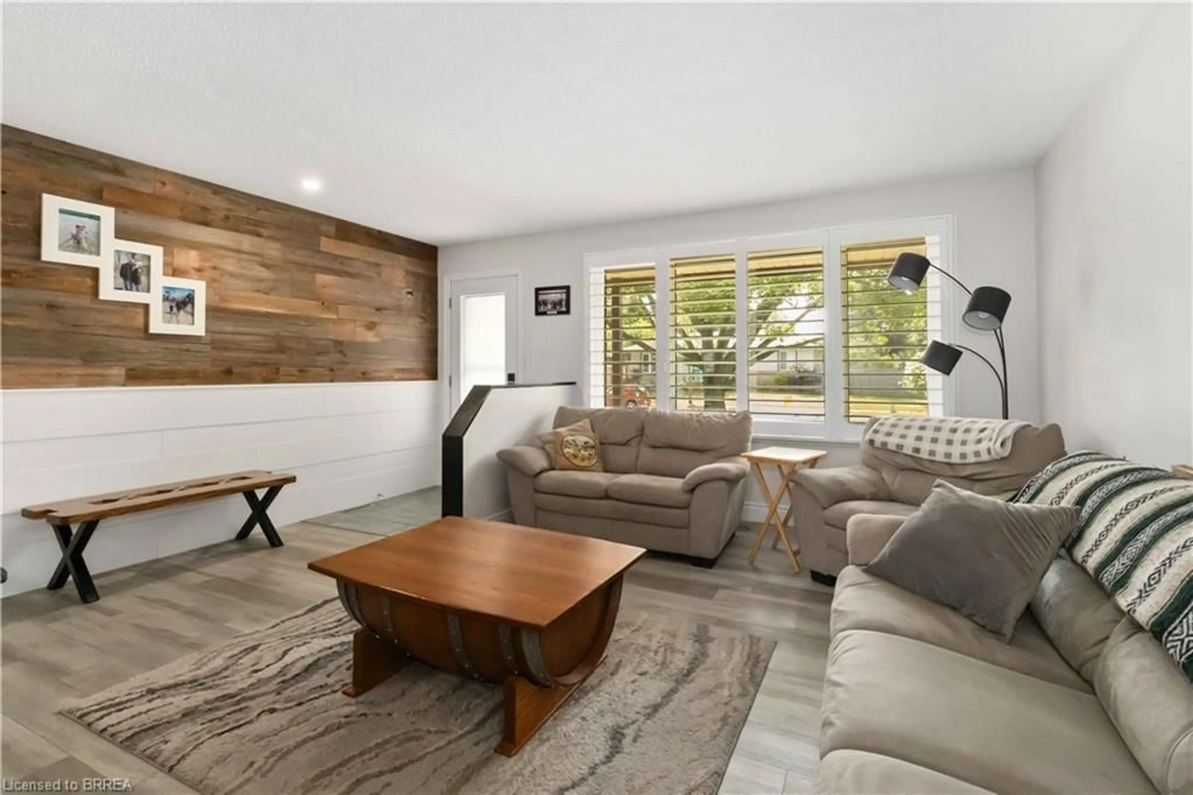 Living room with furniture, wood/laminate floor for 8 Hawthorne Lane, Brantford Ontario N3R 6H8