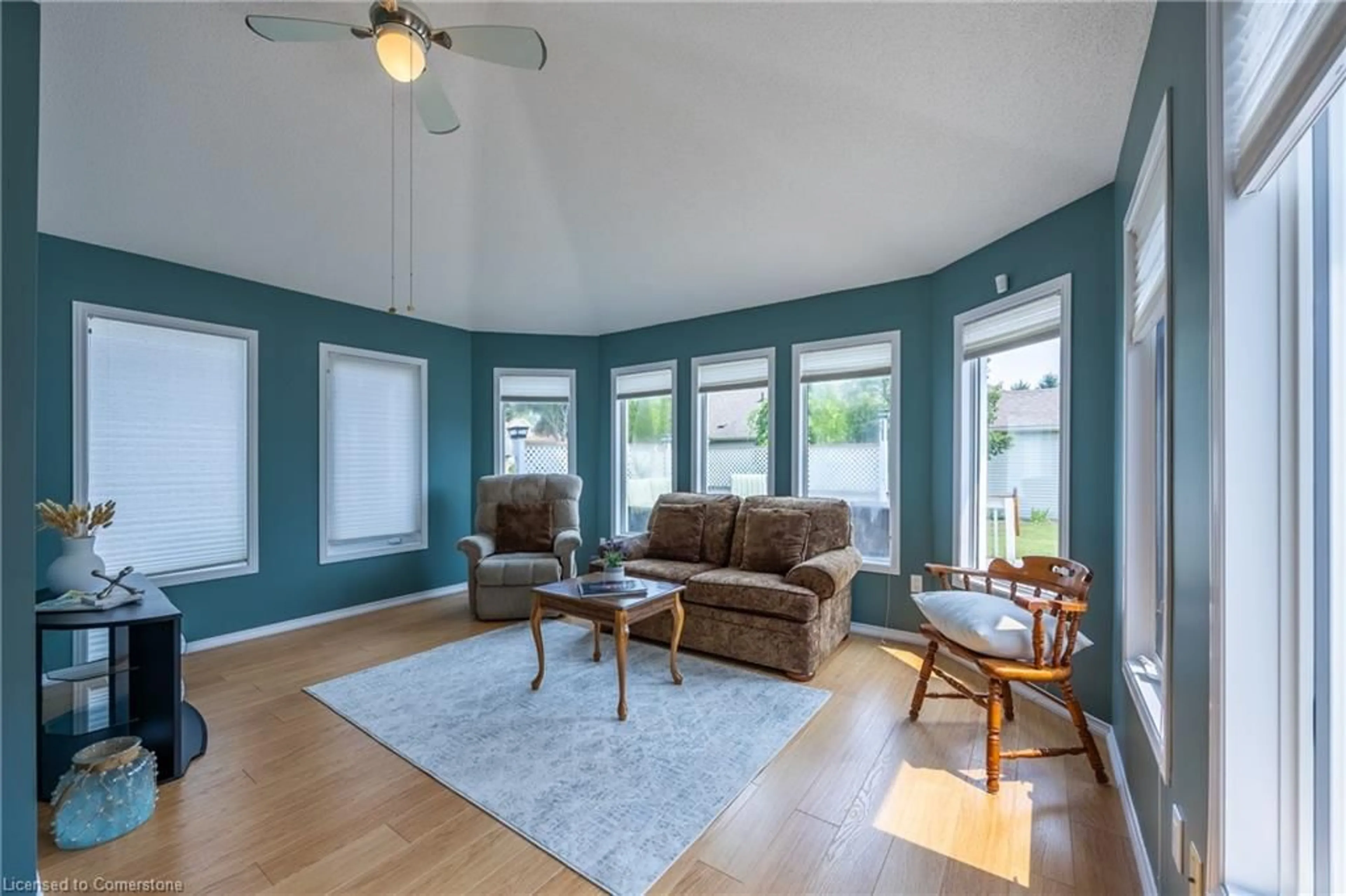 Living room with furniture, wood/laminate floor for 9 Walsingham Dr, Port Rowan Ontario N0E 1M0