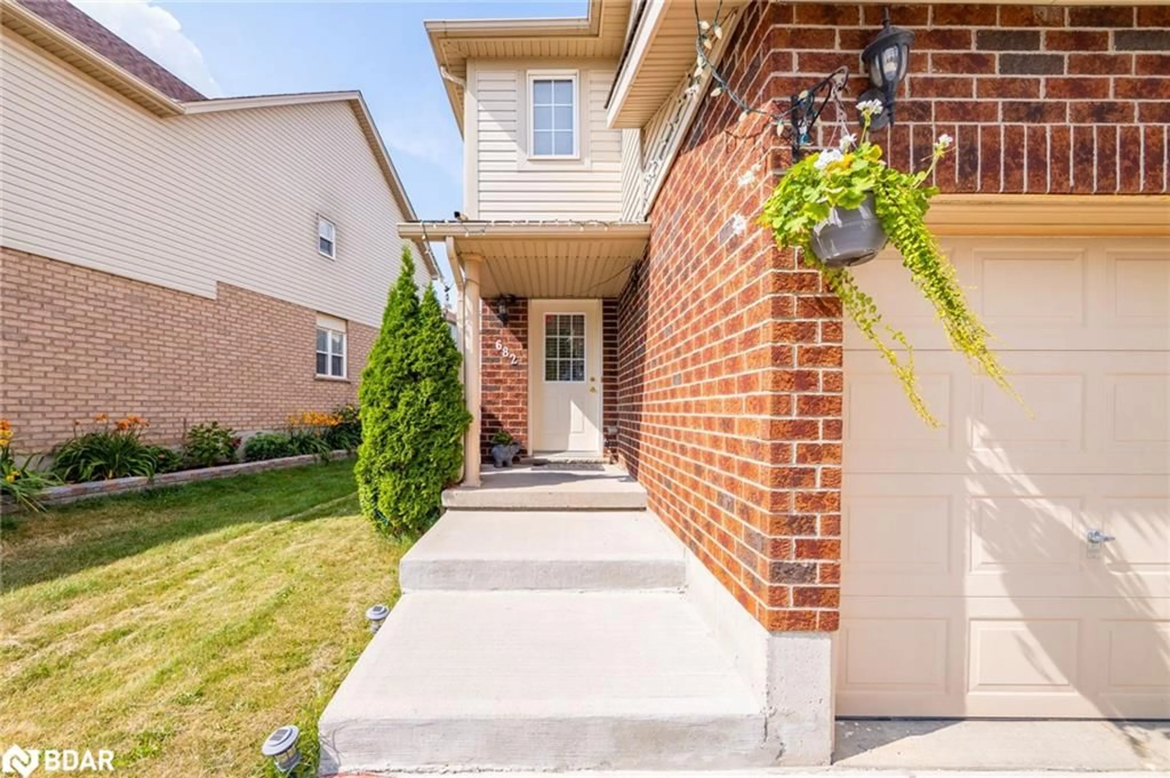 Home with brick exterior material, street for 682 Activa Ave, Kitchener Ontario N2E 4E1
