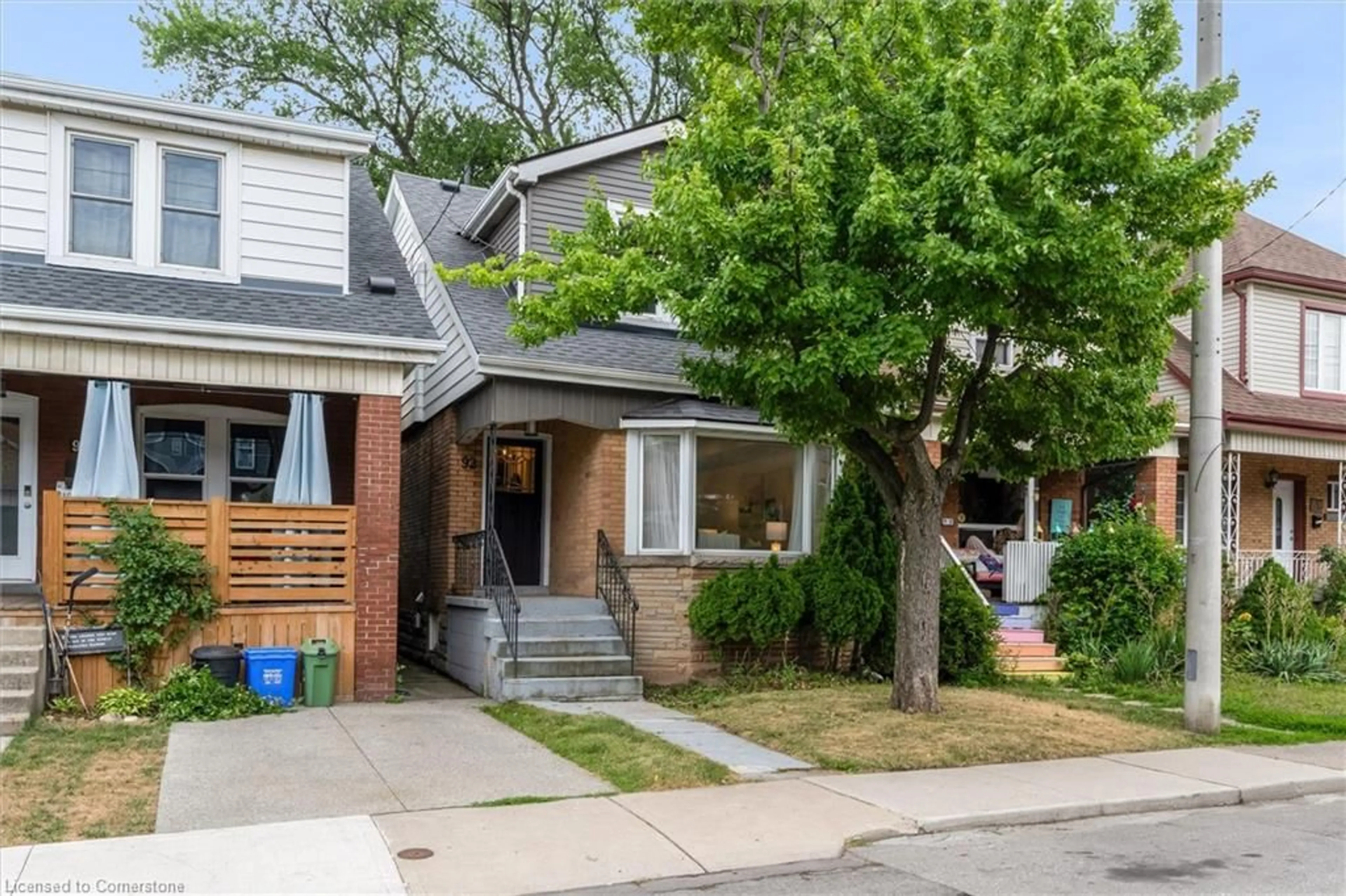 Home with brick exterior material, street for 92 Kensington Ave, Hamilton Ontario L8L 7N2
