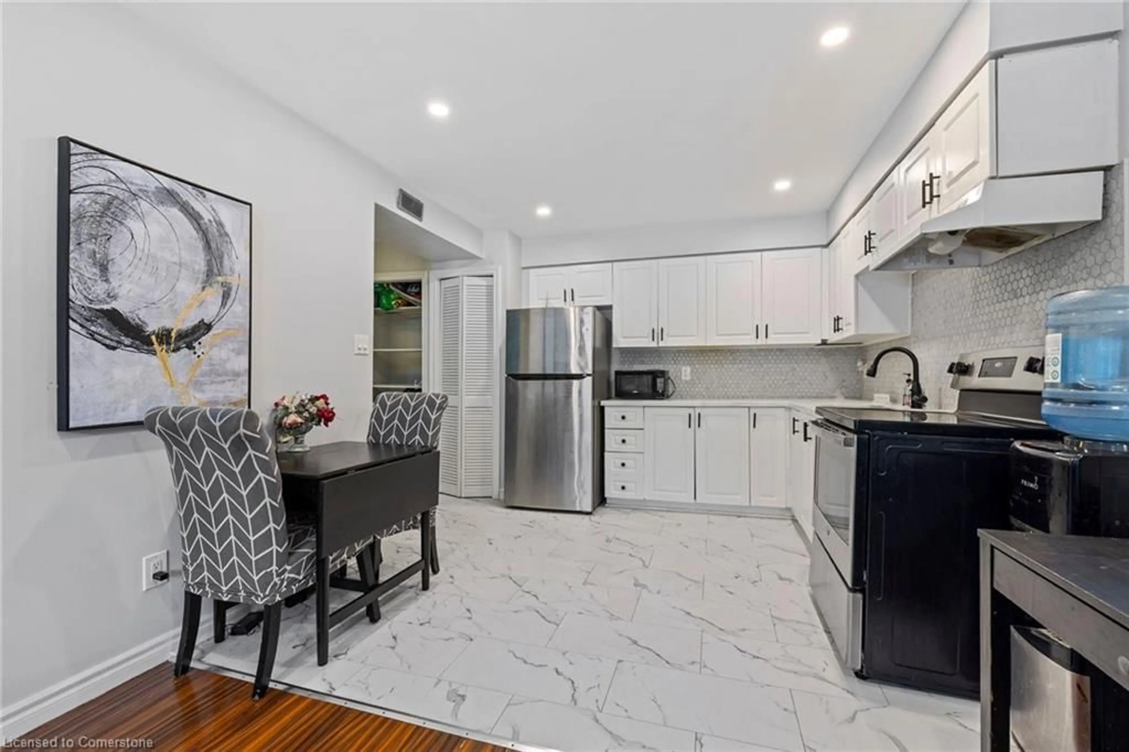 Open concept kitchen, ceramic/tile floor for 28 Victoria Ave #104, Hamilton Ontario L8L 5E1