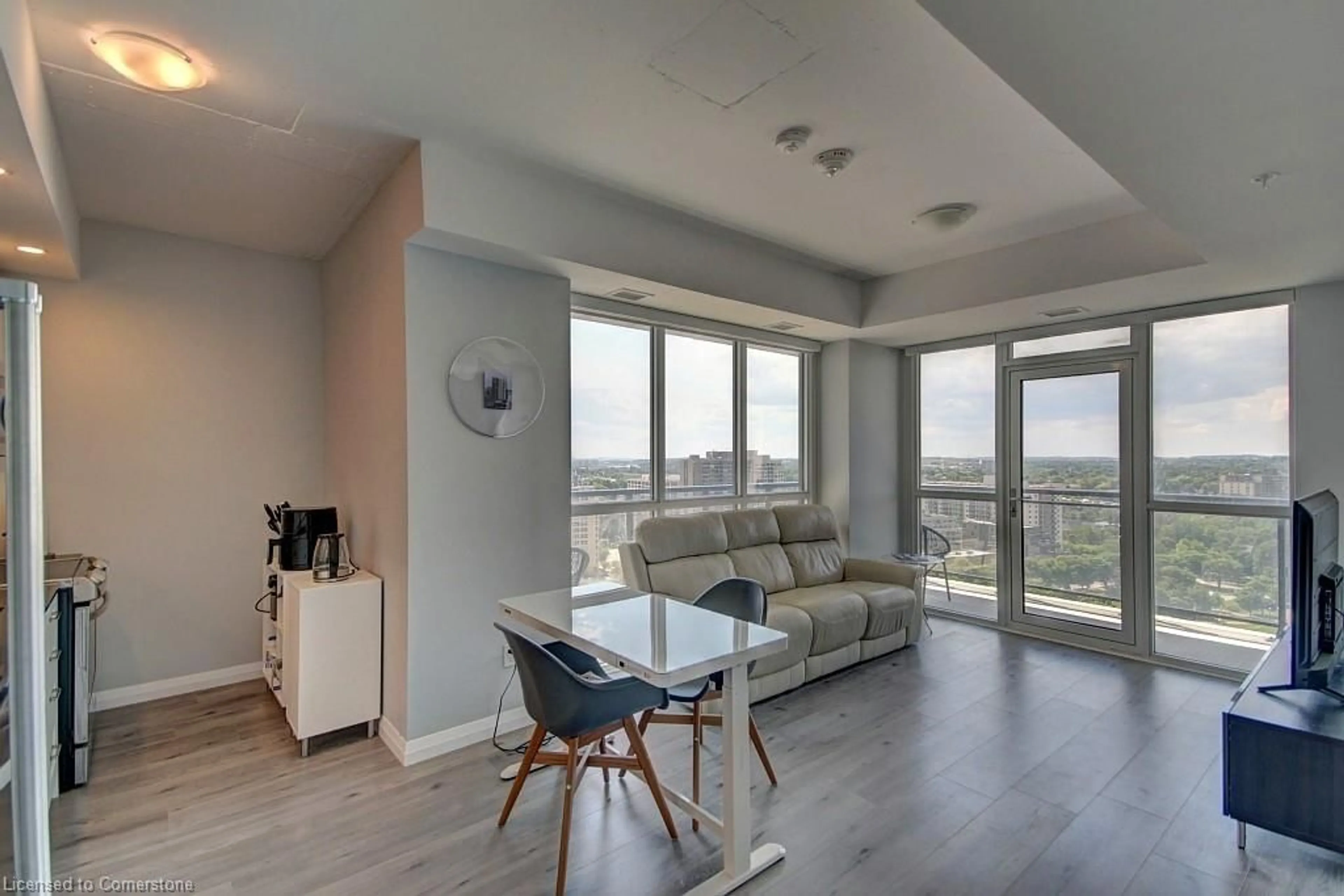 Living room with furniture, wood/laminate floor for 60 Charles St #1805, Kitchener Ontario N2G 0C9