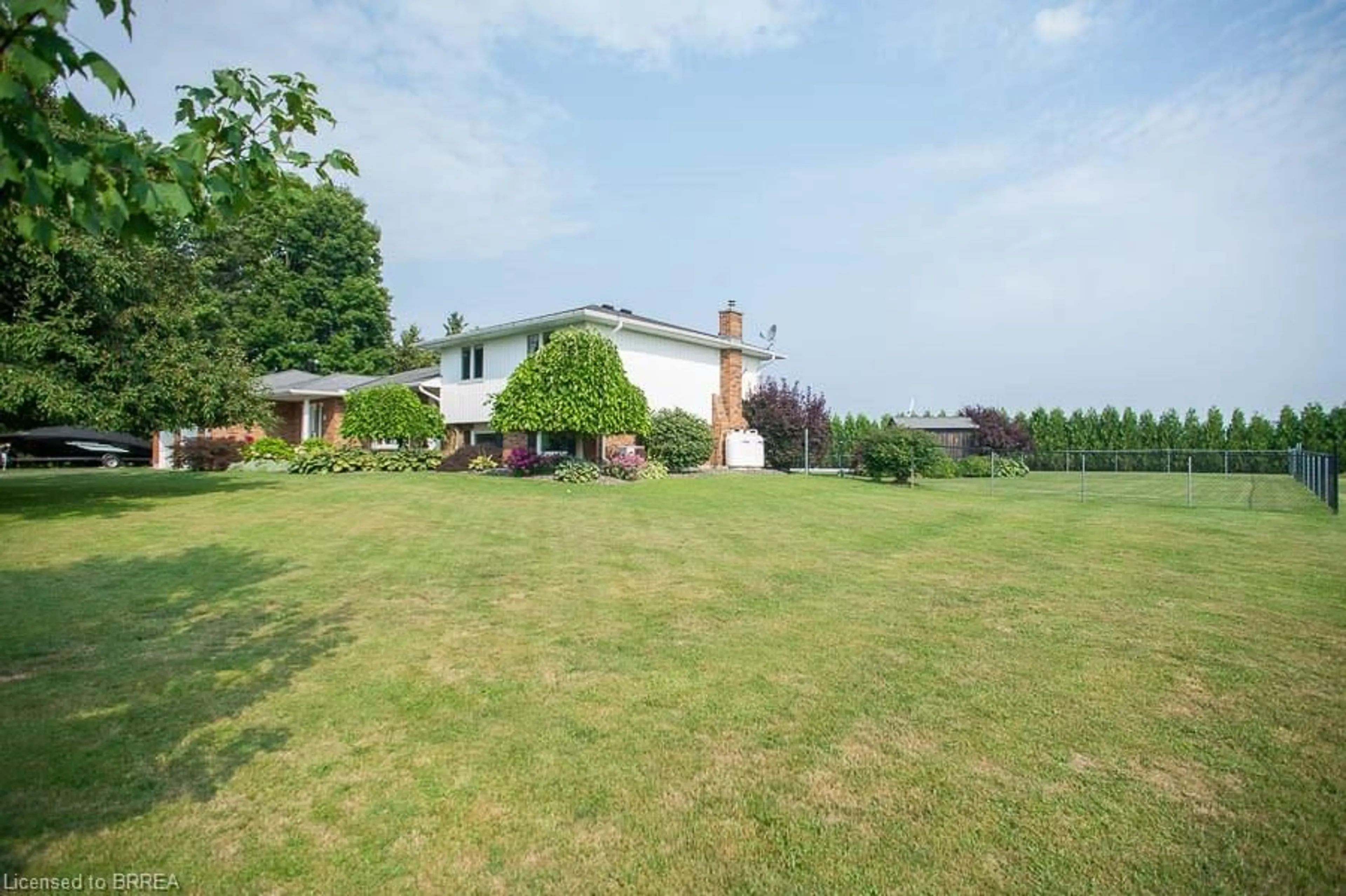 A pic from outside/outdoor area/front of a property/back of a property/a pic from drone, mountain view for 1449 Windham Road 12, Simcoe Ontario N3Y 4K3