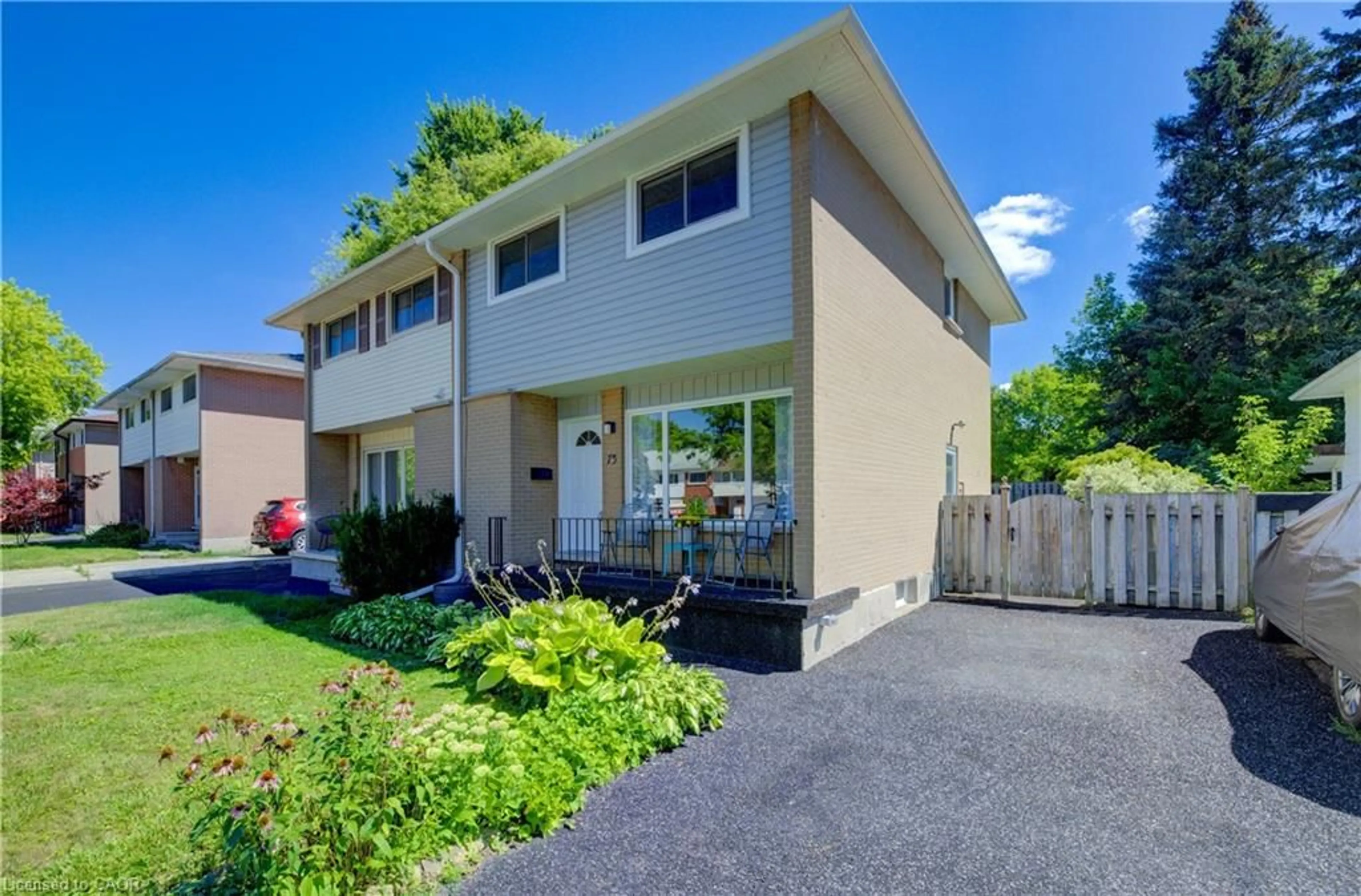 Home with vinyl exterior material, street for 73 Overlea Dr, Kitchener Ontario N2M 1S9