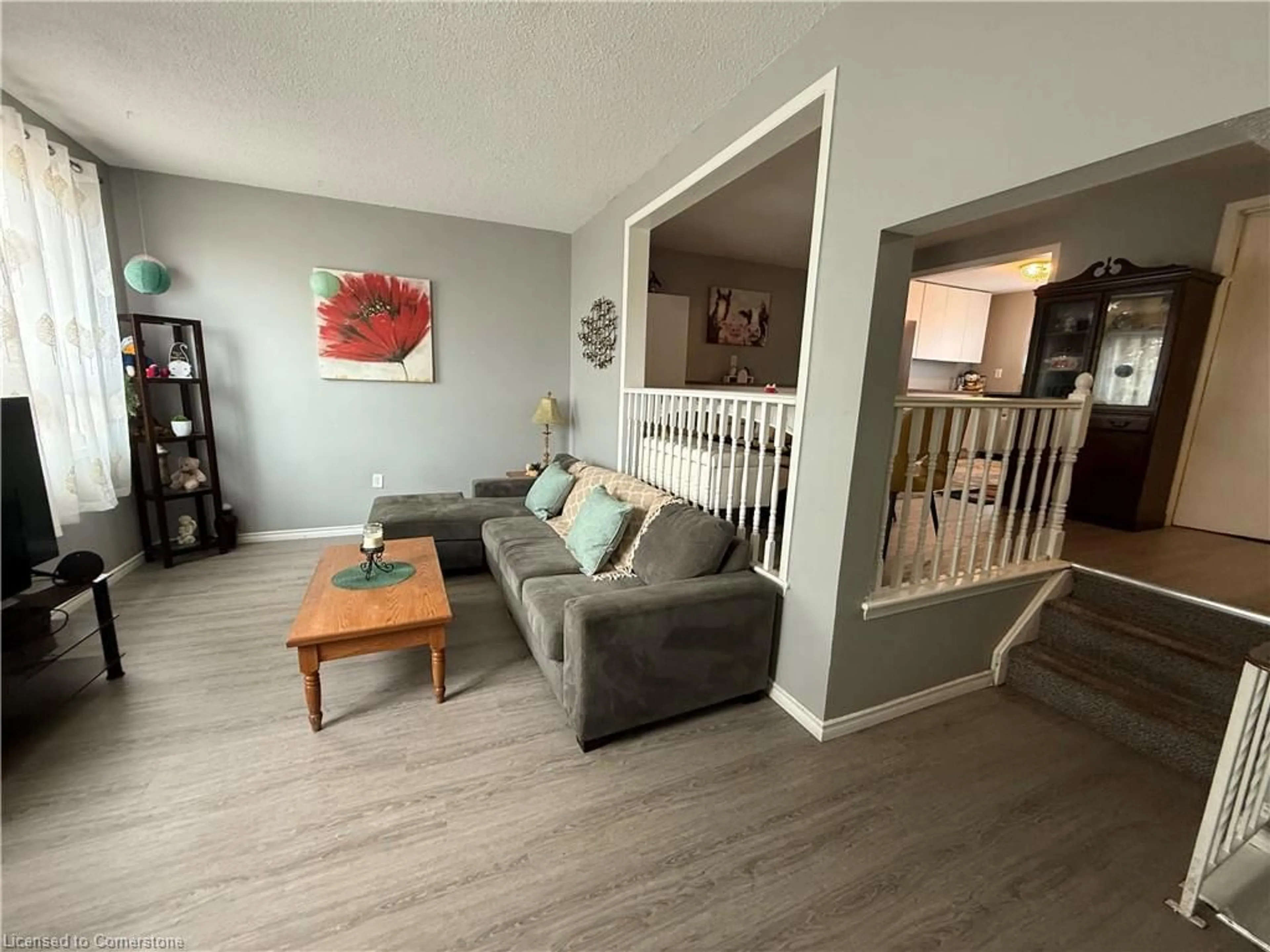 Living room with furniture, wood/laminate floor for 1250 Limeridge Rd #11, Hamilton Ontario L8W 1P1
