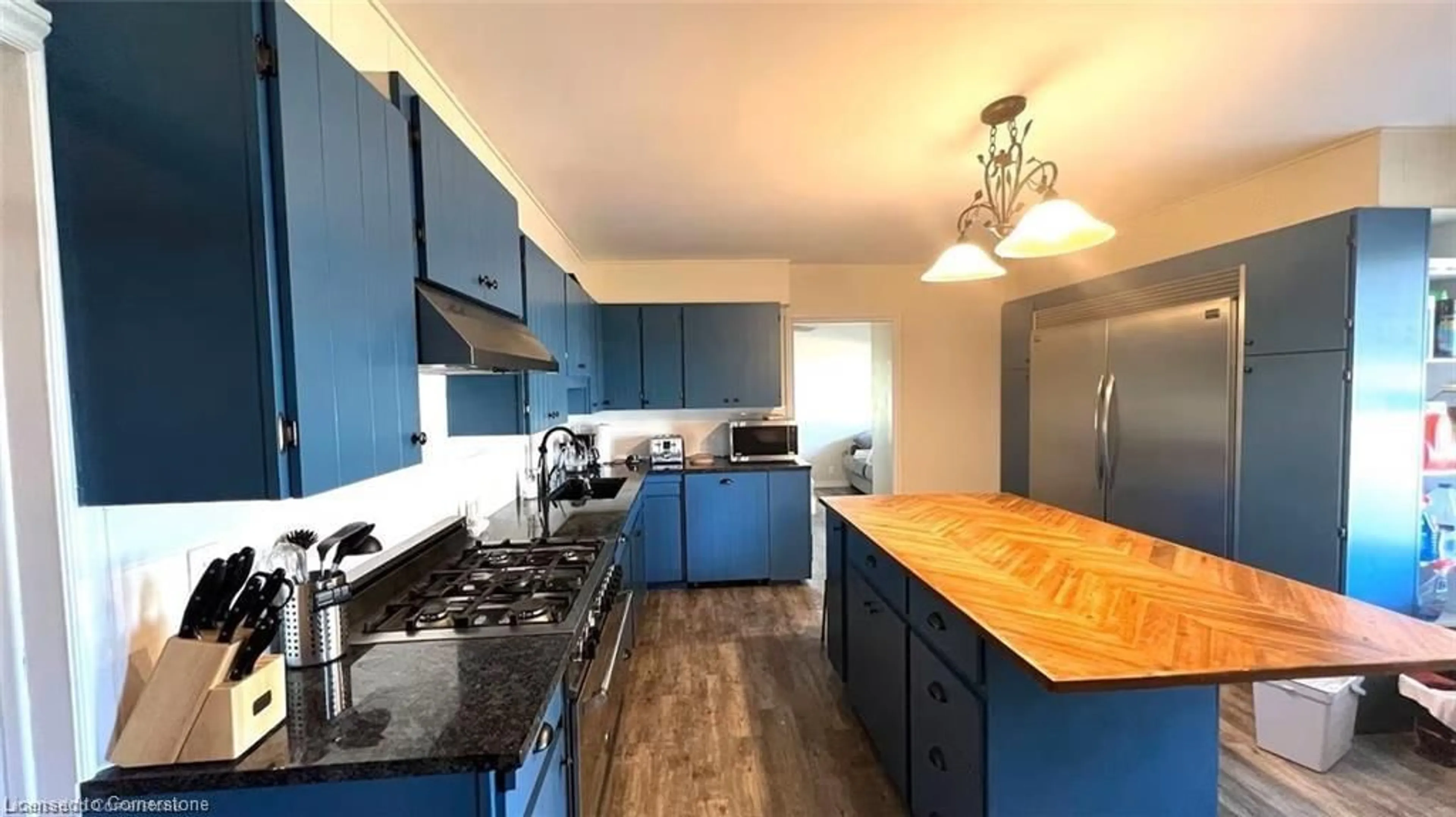 Open concept kitchen, wood/laminate floor for 1590 Middleton North Walsingham Rd, Walsingham Ontario N4B 2W4