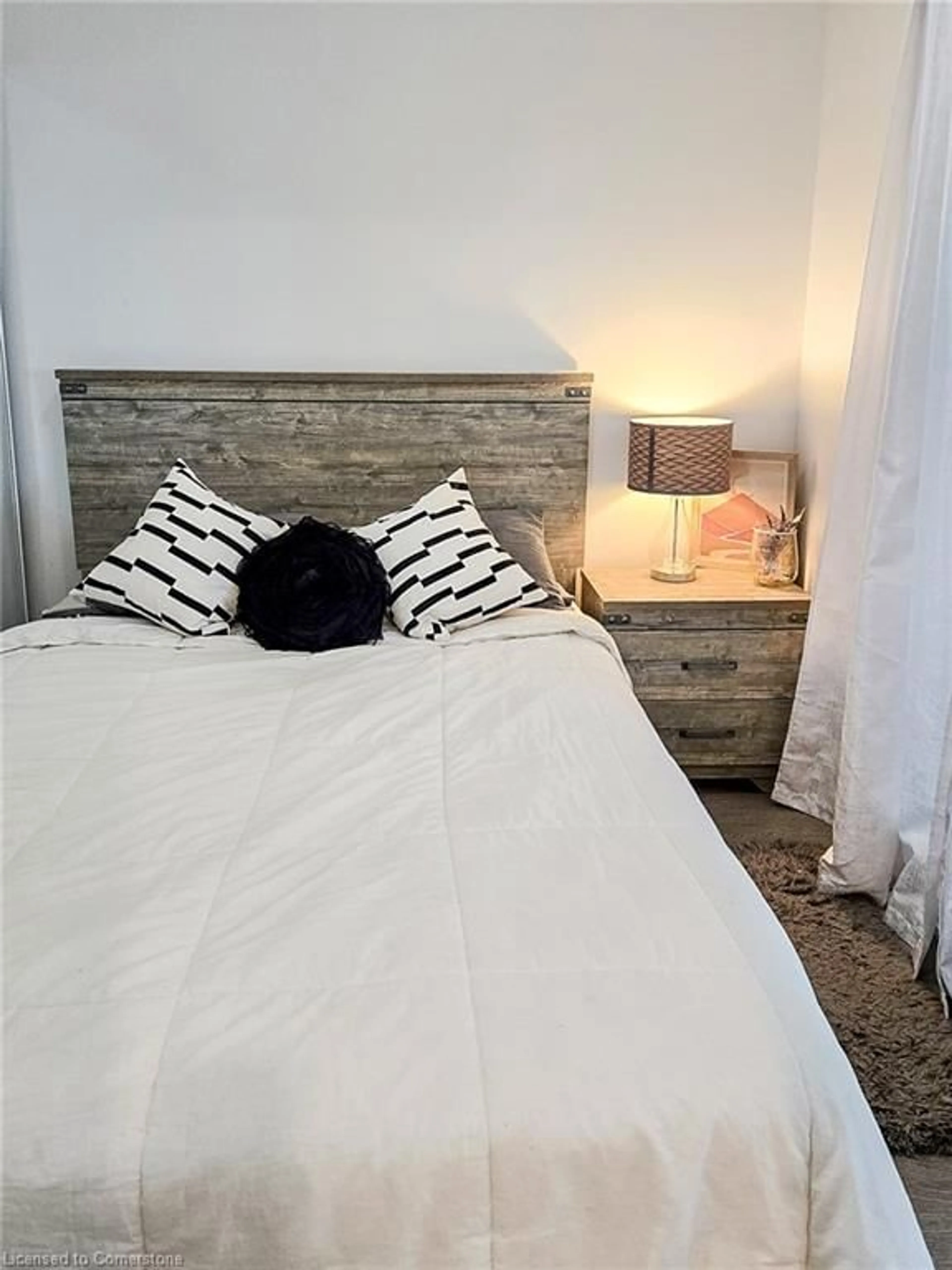 Bedroom with bed, wood/laminate floor for 65 Annie Craig Dr #1006, Toronto Ontario M8V 0G3
