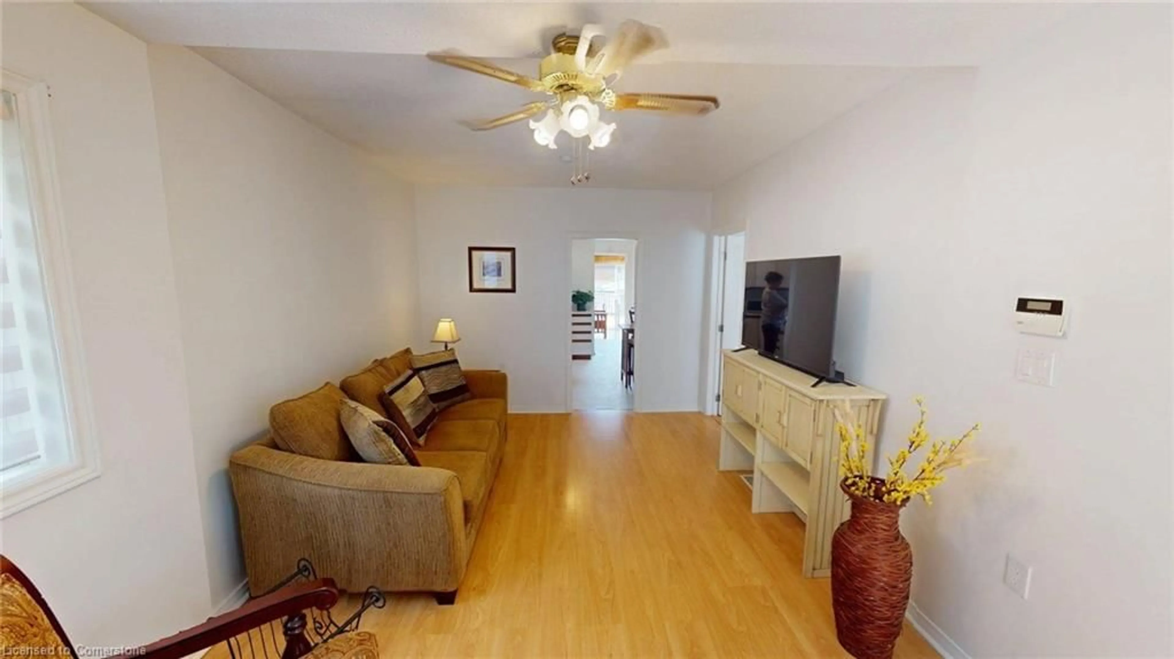 Living room with furniture, wood/laminate floor for 26 Kent St, St. Catharines Ontario L2S 1H2