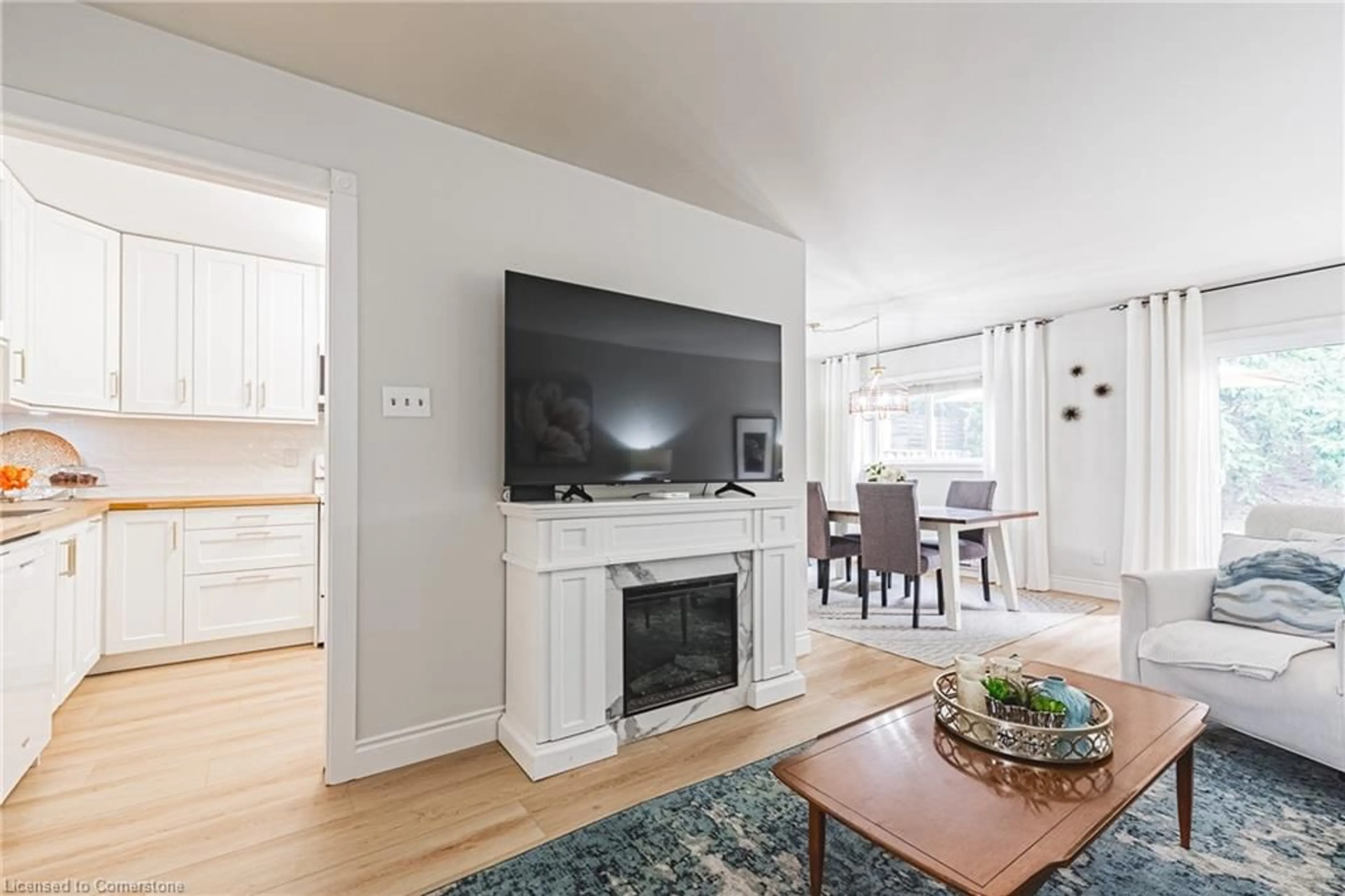 Living room with furniture, wood/laminate floor for 1419 Ester Dr, Burlington Ontario L7P 1L5