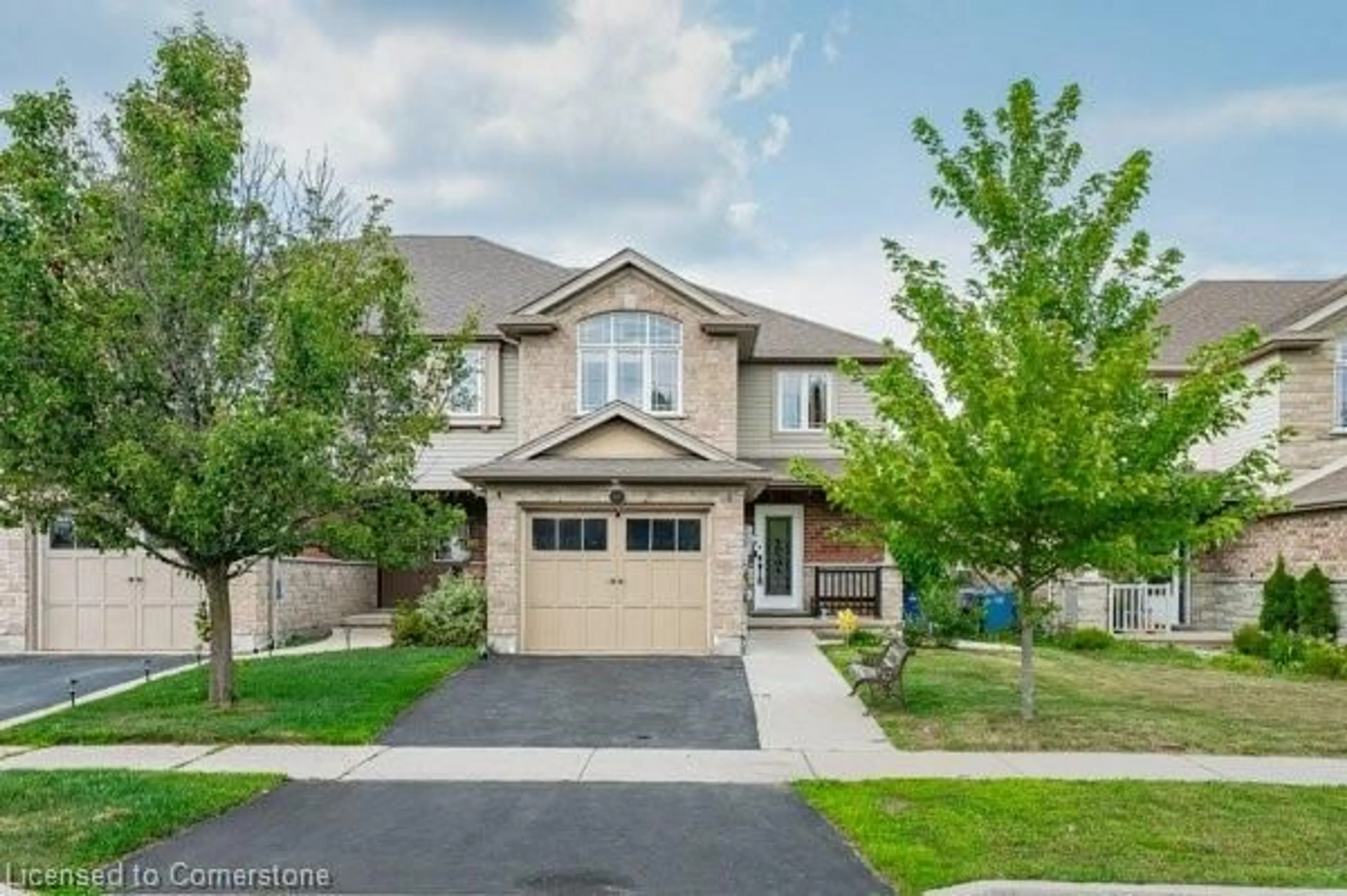 Home with brick exterior material, street for 40 Laughland Lane, Guelph Ontario N1L 0C9