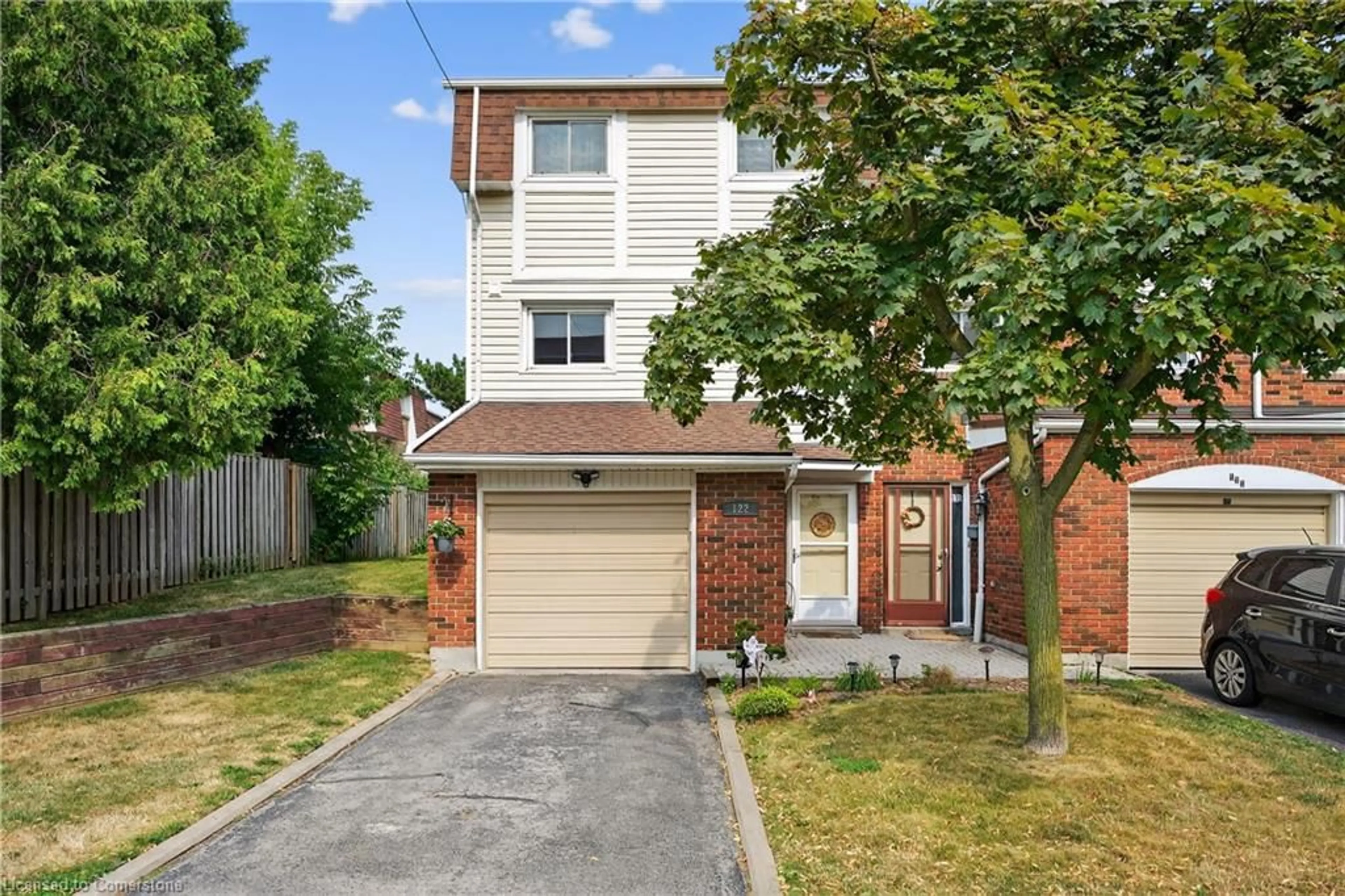 Home with brick exterior material, street for 11 Harrisford St #122, Hamilton Ontario L8K 6L7