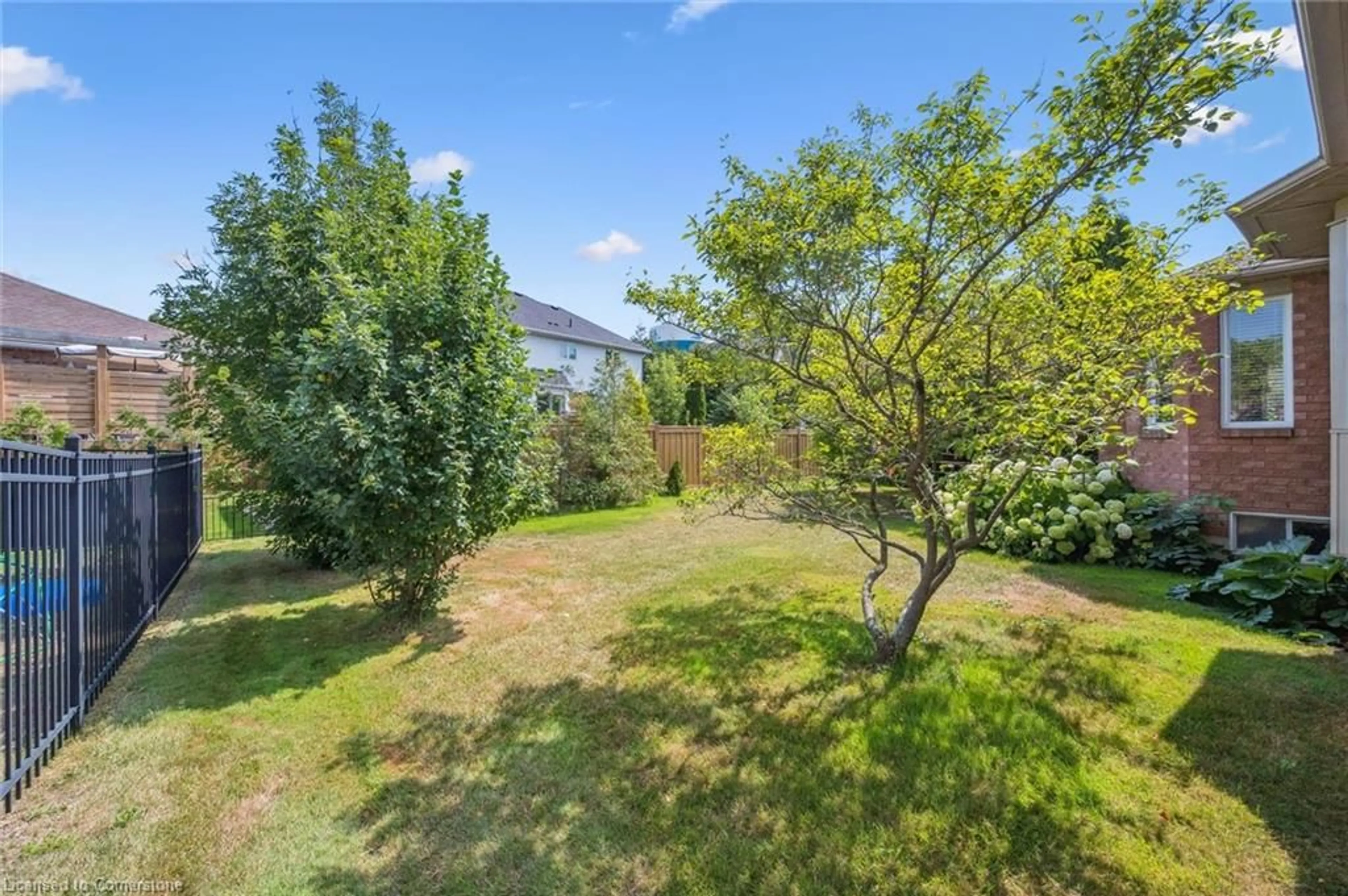 A pic from outside/outdoor area/front of a property/back of a property/a pic from drone, forest/trees view for 267 Irvine St, Elora Ontario N0B 1S0