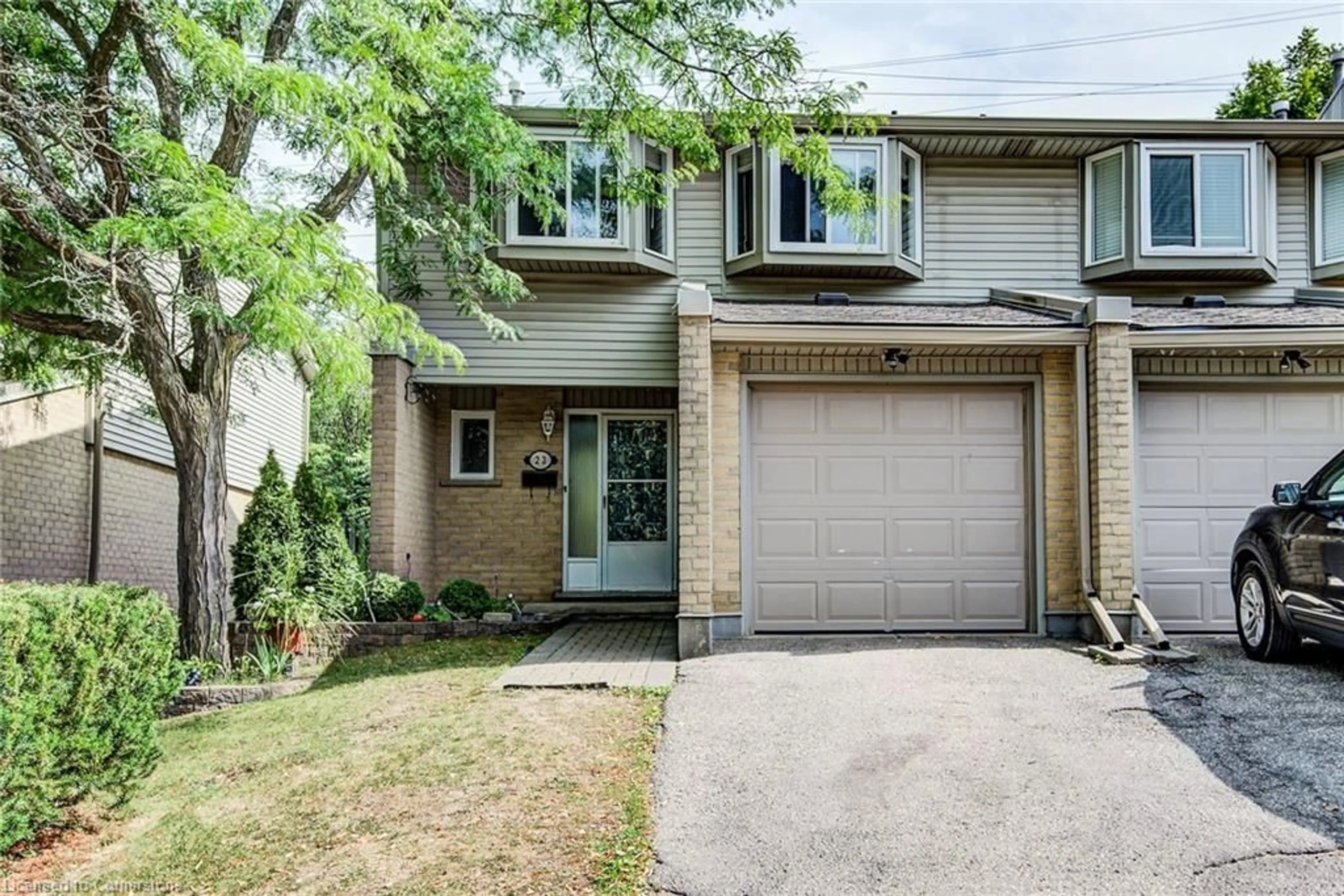 Home with brick exterior material, street for 29 Paulander Dr #23, Kitchener Ontario N2M 5L2