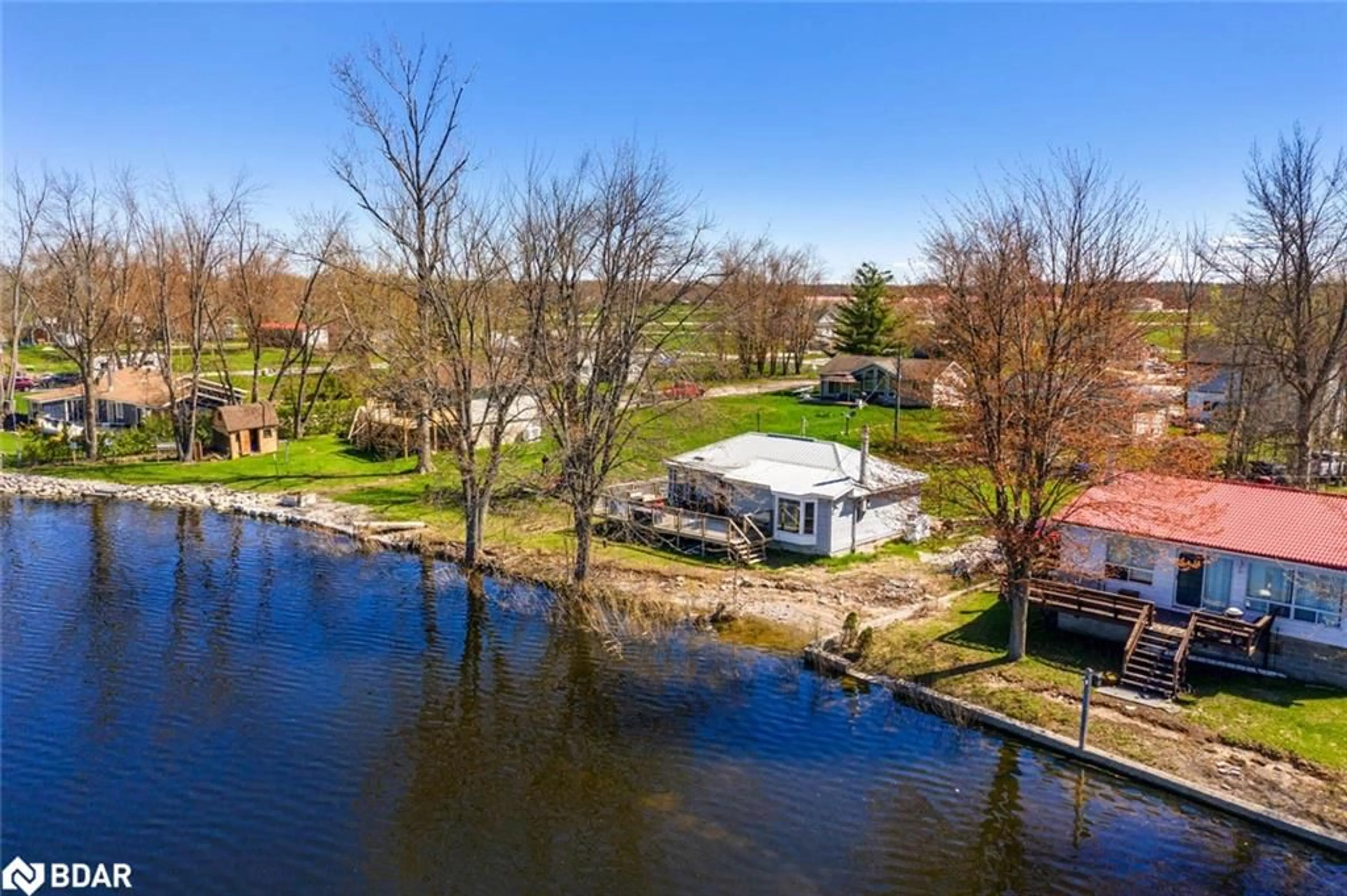 A pic from outside/outdoor area/front of a property/back of a property/a pic from drone, water/lake/river/ocean view for 6222 Bluebird St, Ramara Ontario L3V 0K6