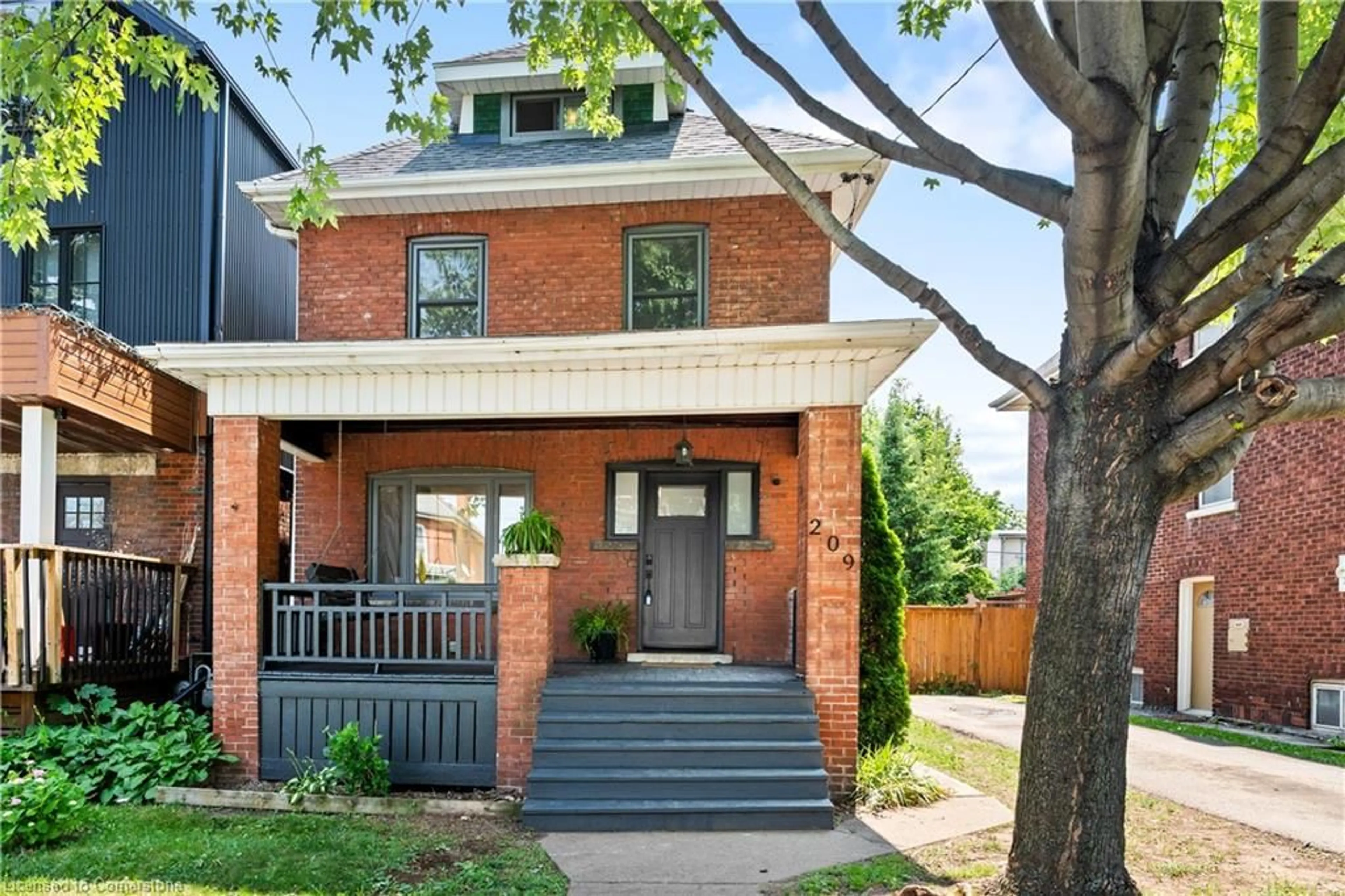 Home with brick exterior material, street for 209 Rothsay Ave, Hamilton Ontario L8M 3G6