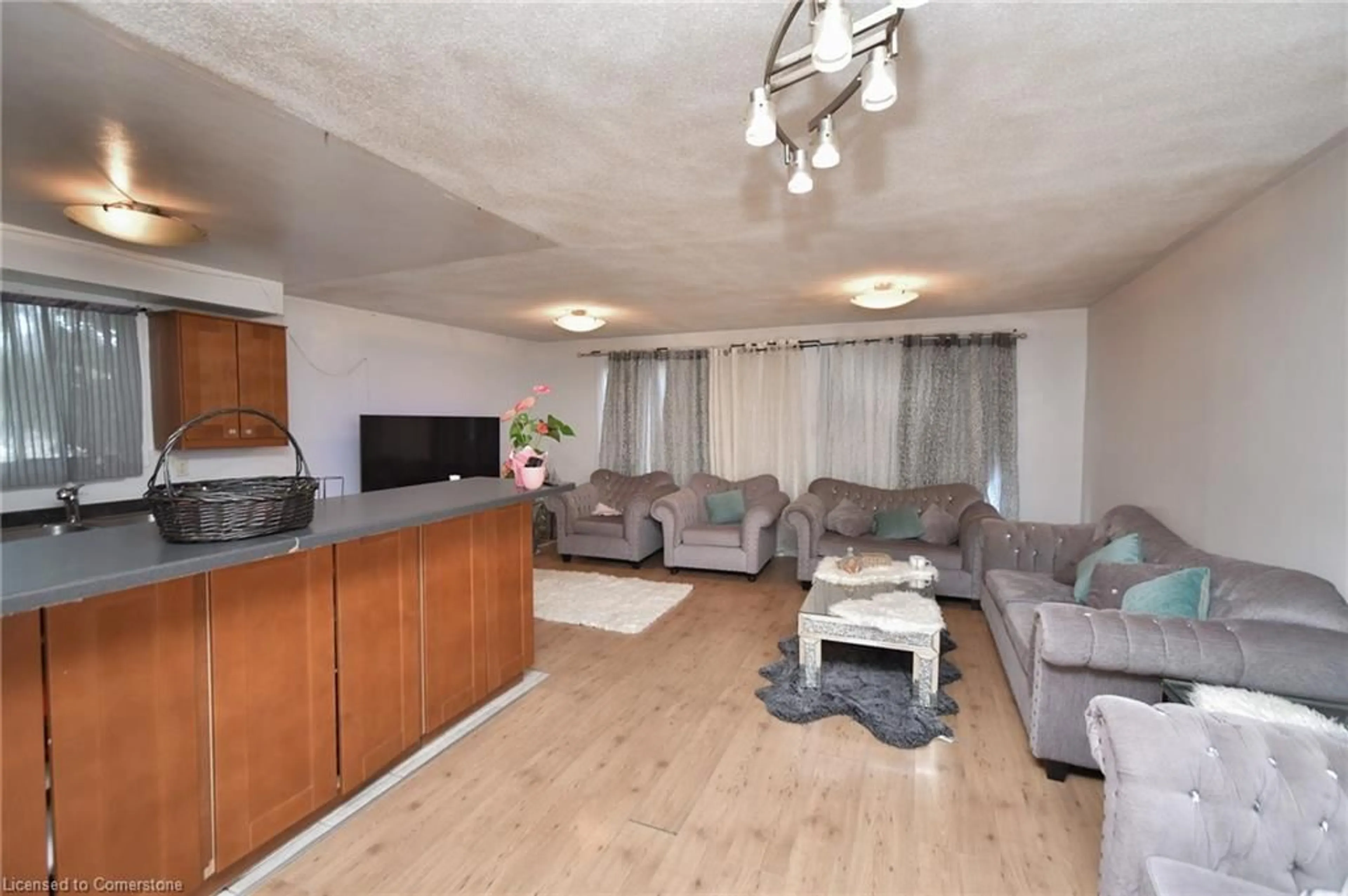 Living room with furniture, wood/laminate floor for 78 Horning Dr, Hamilton Ontario L9C 6L1
