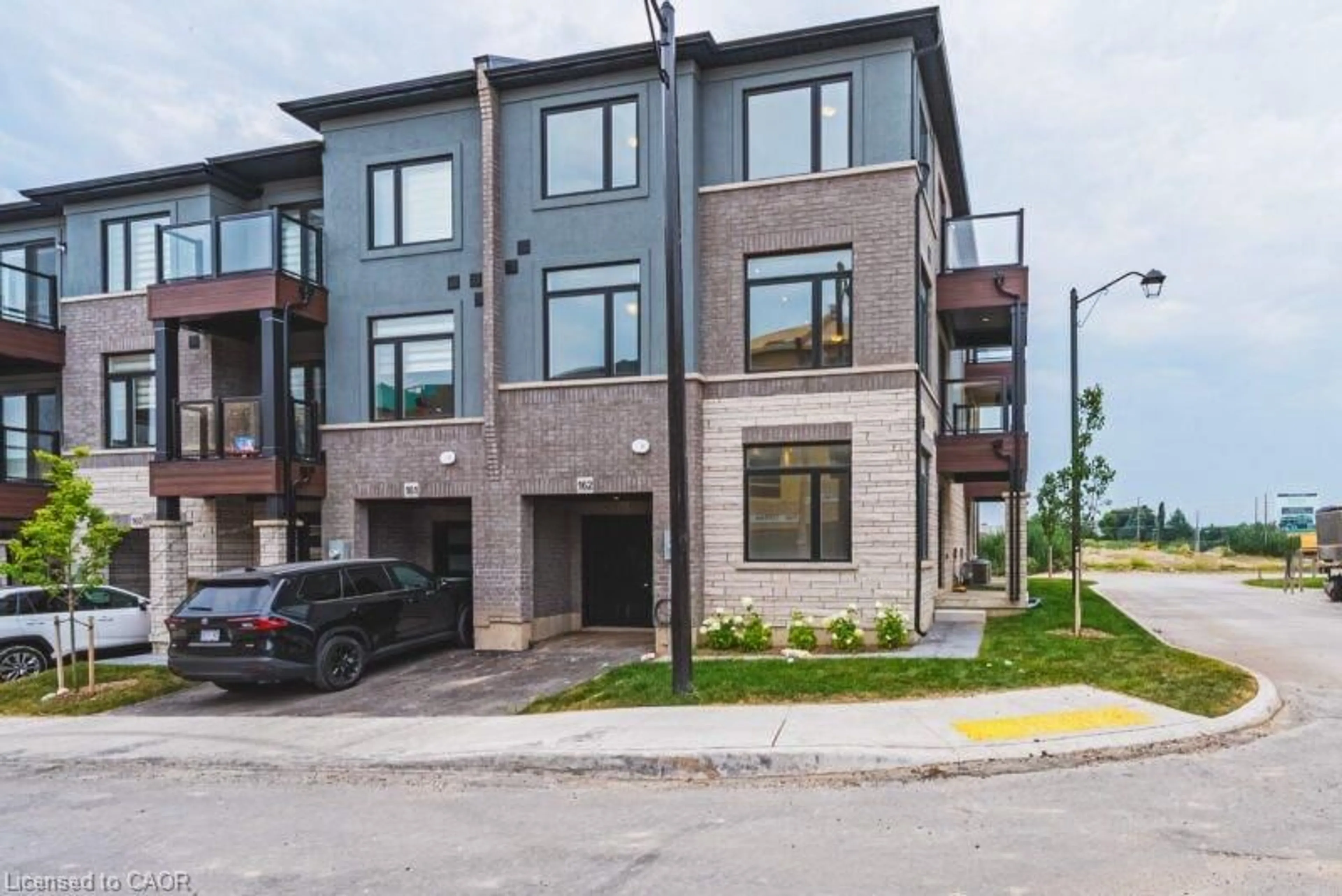 Home with brick exterior material, street for 155 Equestrian Way #162, Cambridge Ontario N3E 0E8