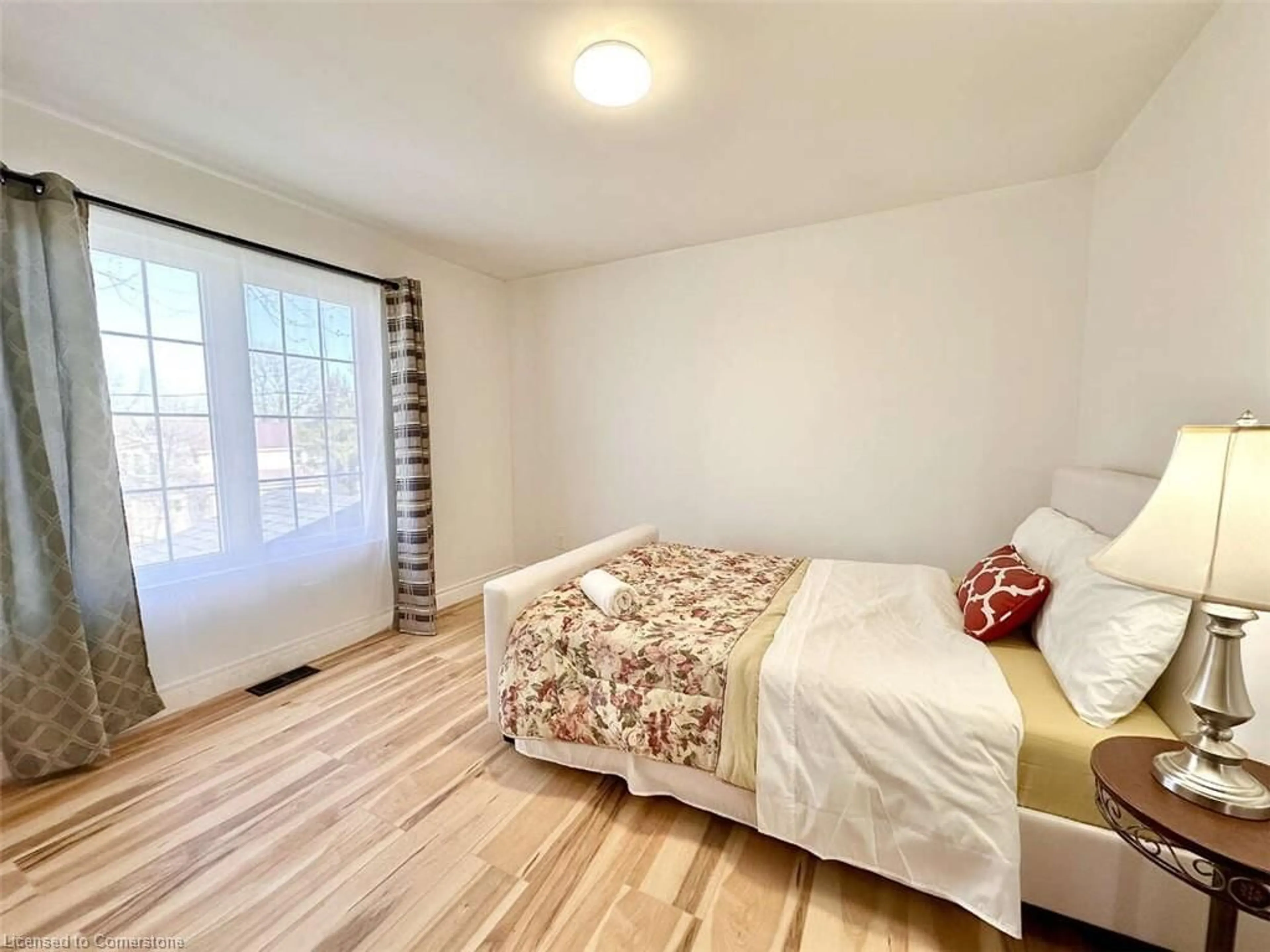 Bedroom with bed, wood/laminate floor for 664 King St, Port Colborne Ontario L3K 4H9