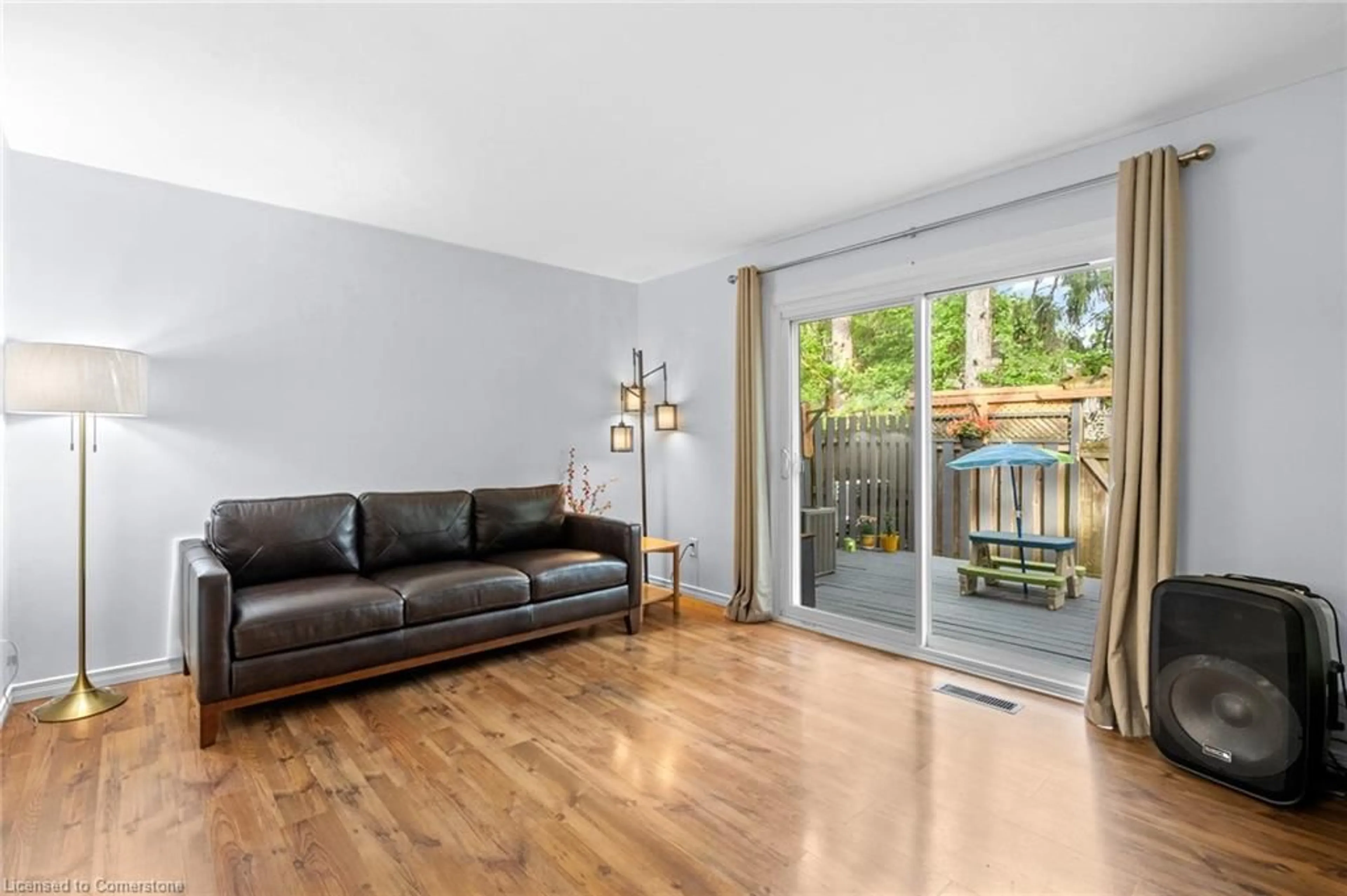 Living room with furniture, wood/laminate floor for 193 Thaler Ave #E, Kitchener Ontario N2A 1R4