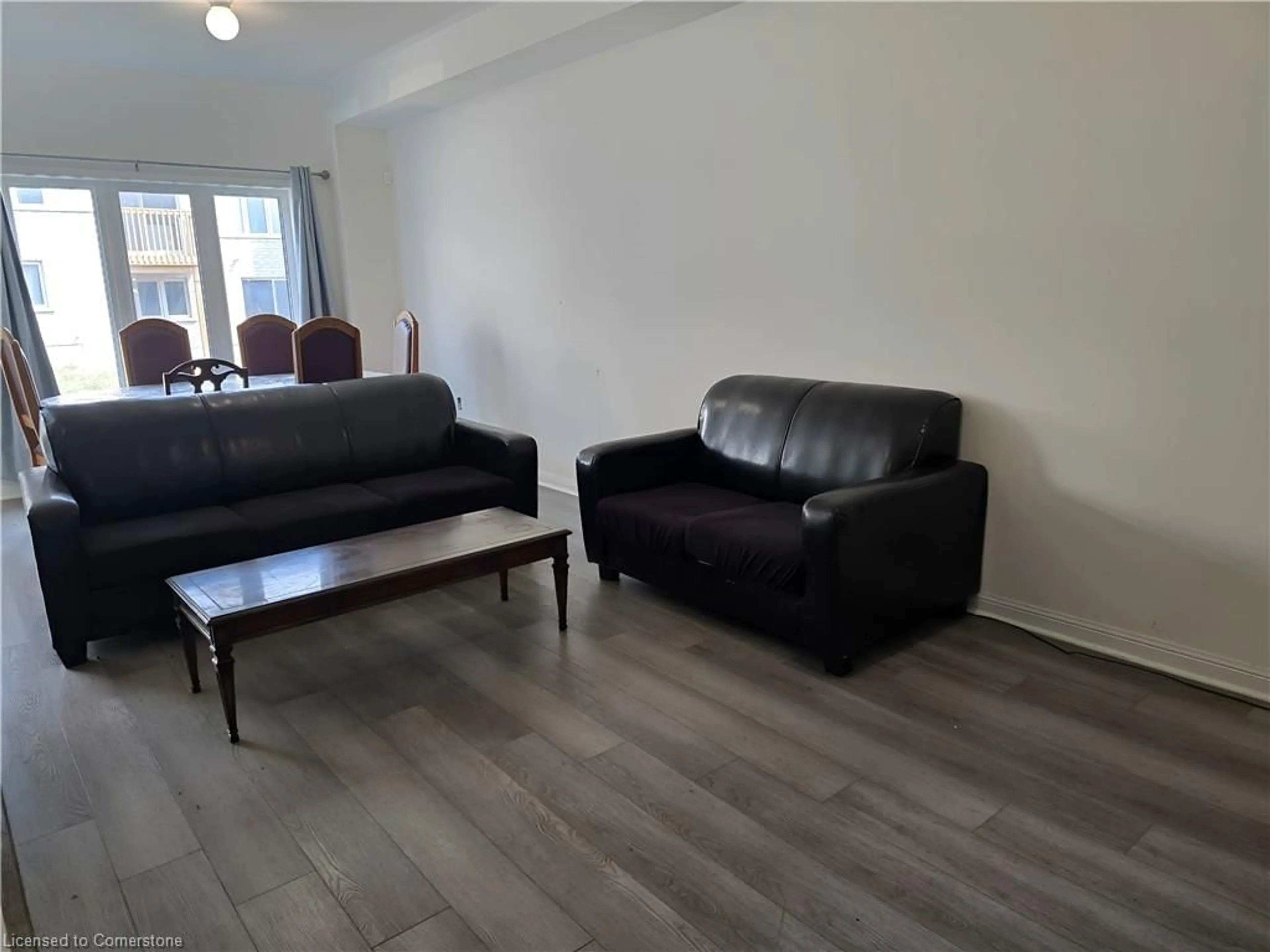Living room with furniture, wood/laminate floor for 2555 Winter Words Drive Dr, Oshawa Ontario L1H 7K4