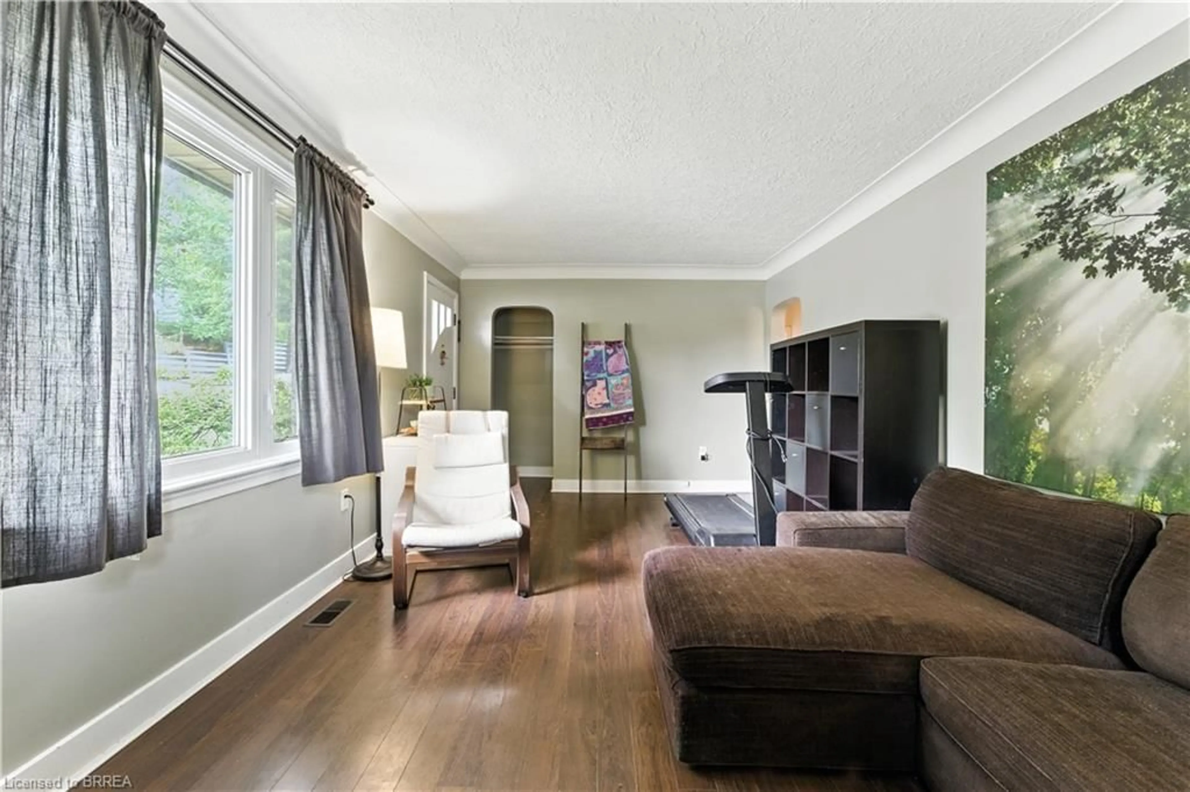 Living room with furniture, wood/laminate floor for 30 Main St, St. George Ontario N0E 1N0