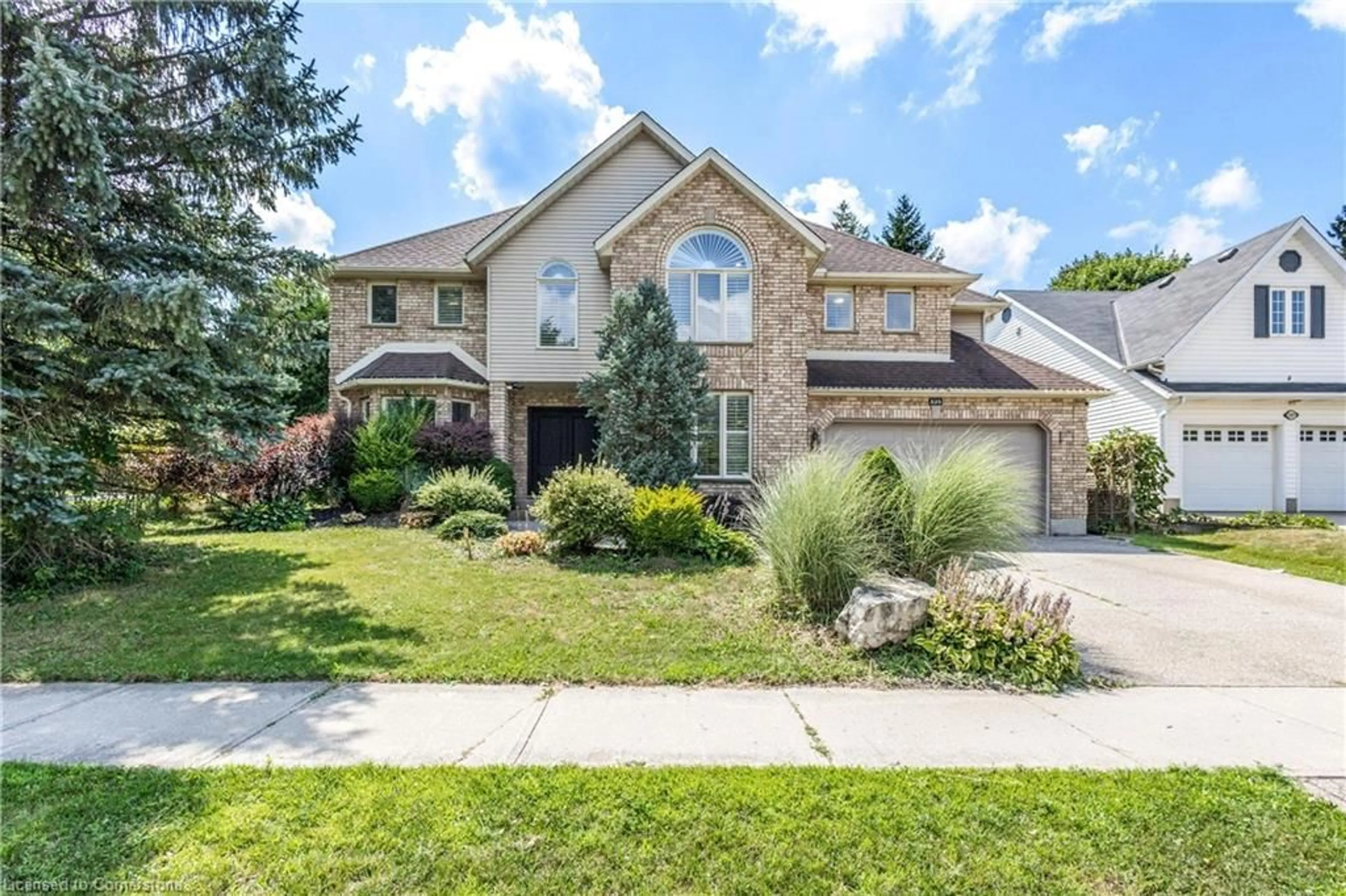 Home with brick exterior material, street for 525 Leighland Dr, Waterloo Ontario N2T 2H5