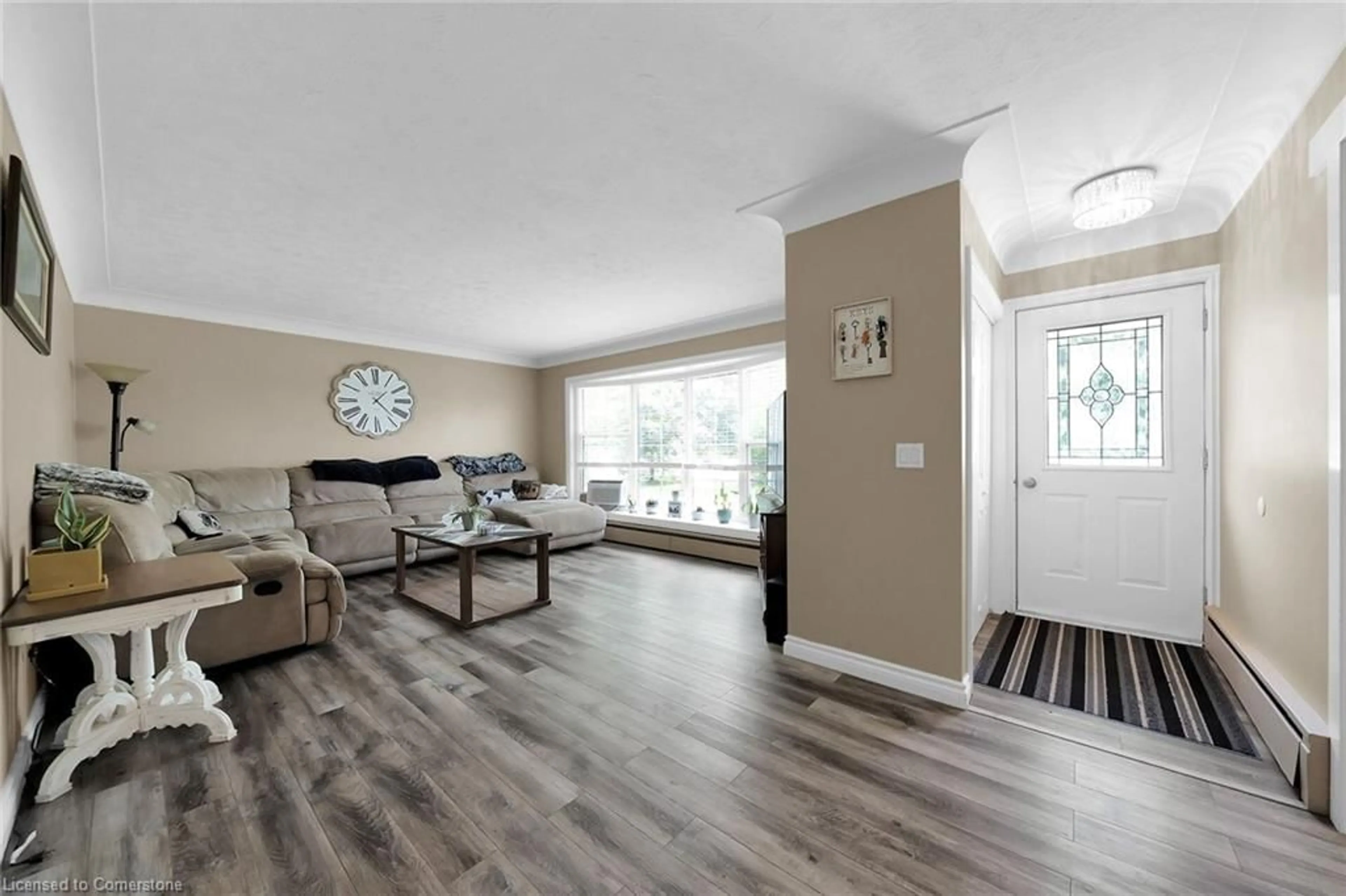 Living room with furniture, wood/laminate floor for 680 Haldimand 20 Rd, Hagersville Ontario N0A 1H0