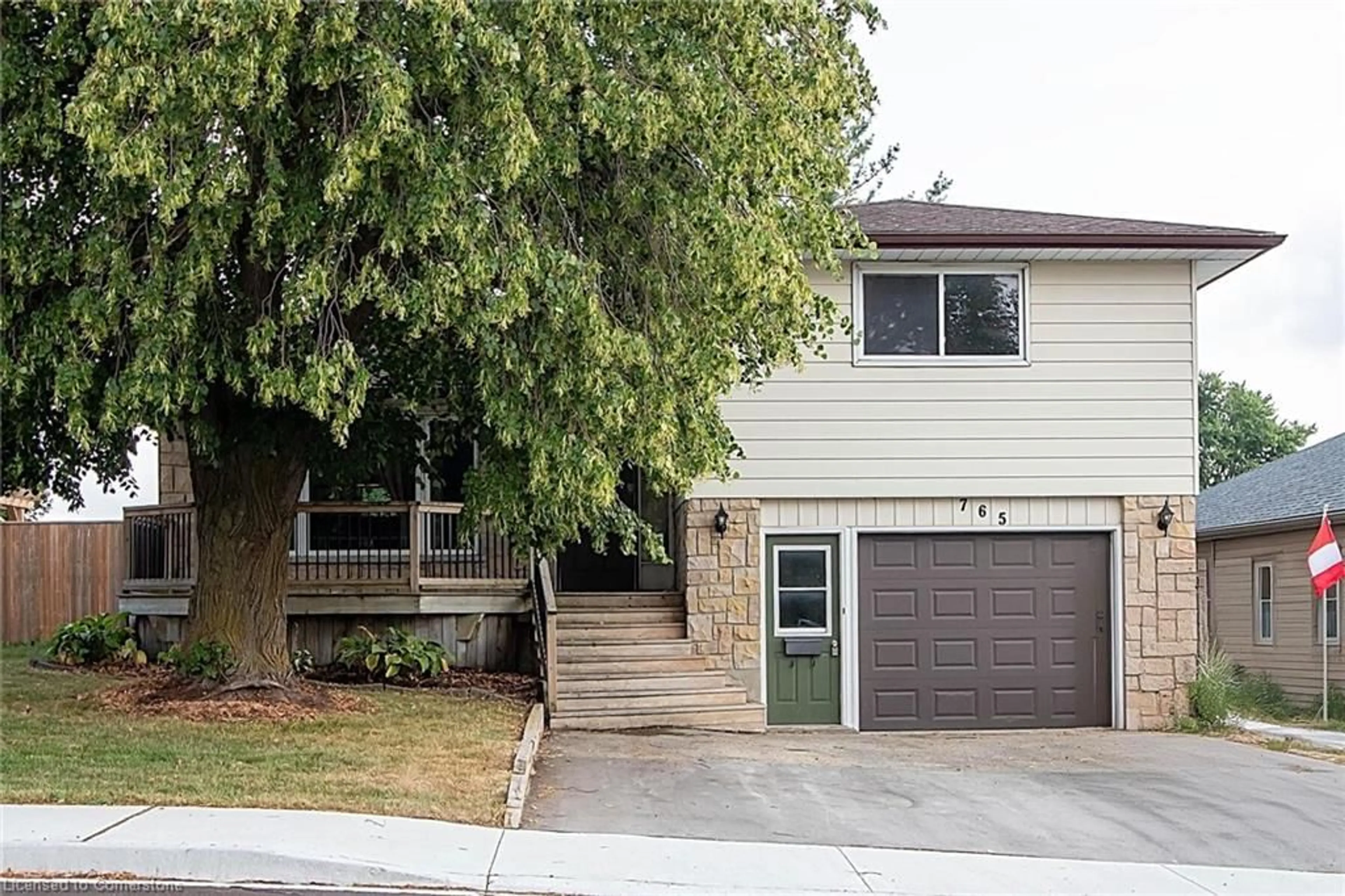 Home with vinyl exterior material, street for 765 John St, Listowel Ontario N4W 1B6