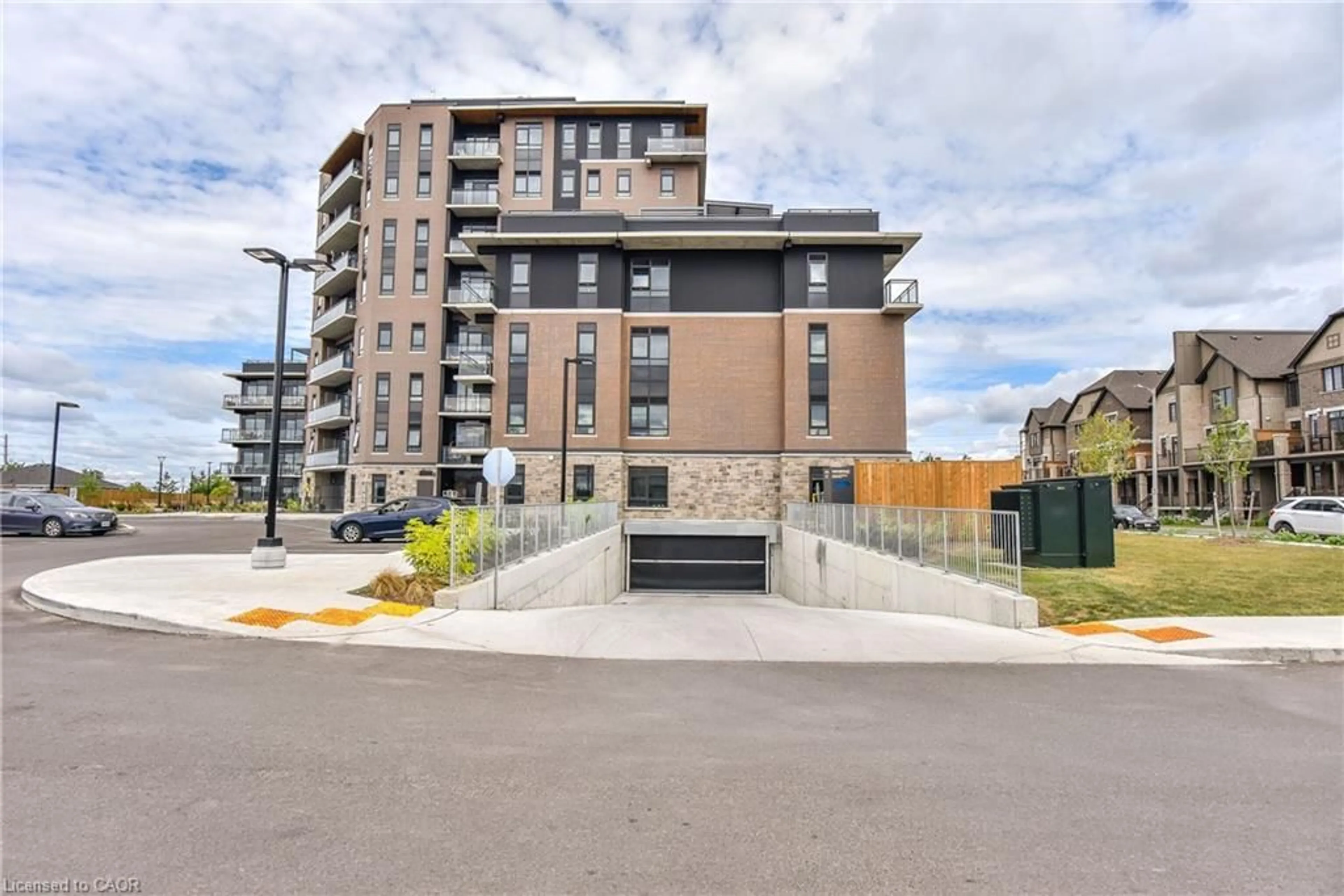 A pic from outside/outdoor area/front of a property/back of a property/a pic from drone, street for 332 Gosling Gdns #102, Guelph Ontario N1L 0P8