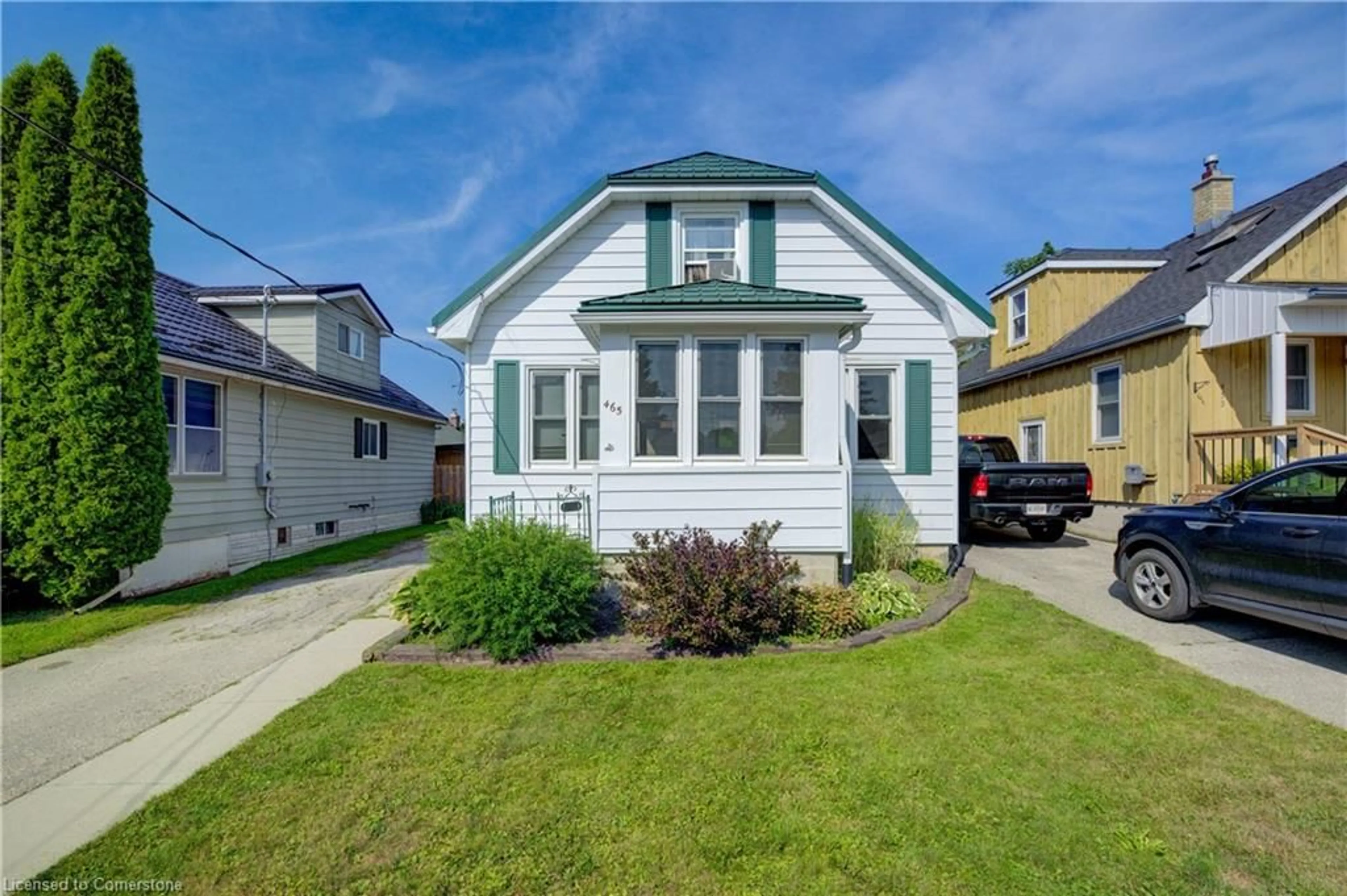 Home with vinyl exterior material, street for 465 John St, Mount Forest Ontario N0G 2L3