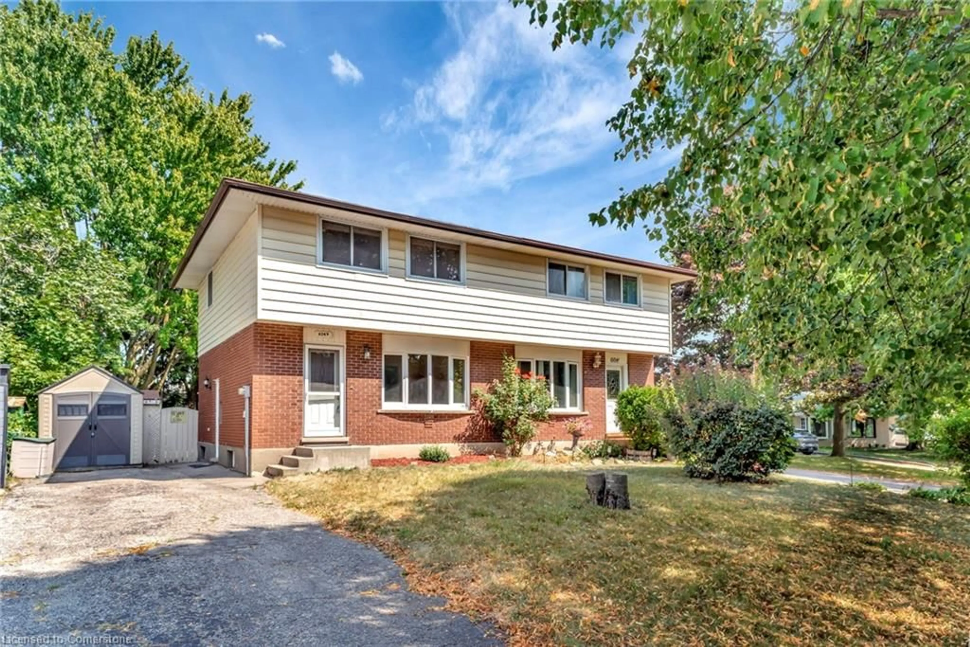 Home with brick exterior material, street for 604 Mount Anne Dr #B, Waterloo Ontario N2L 4W3